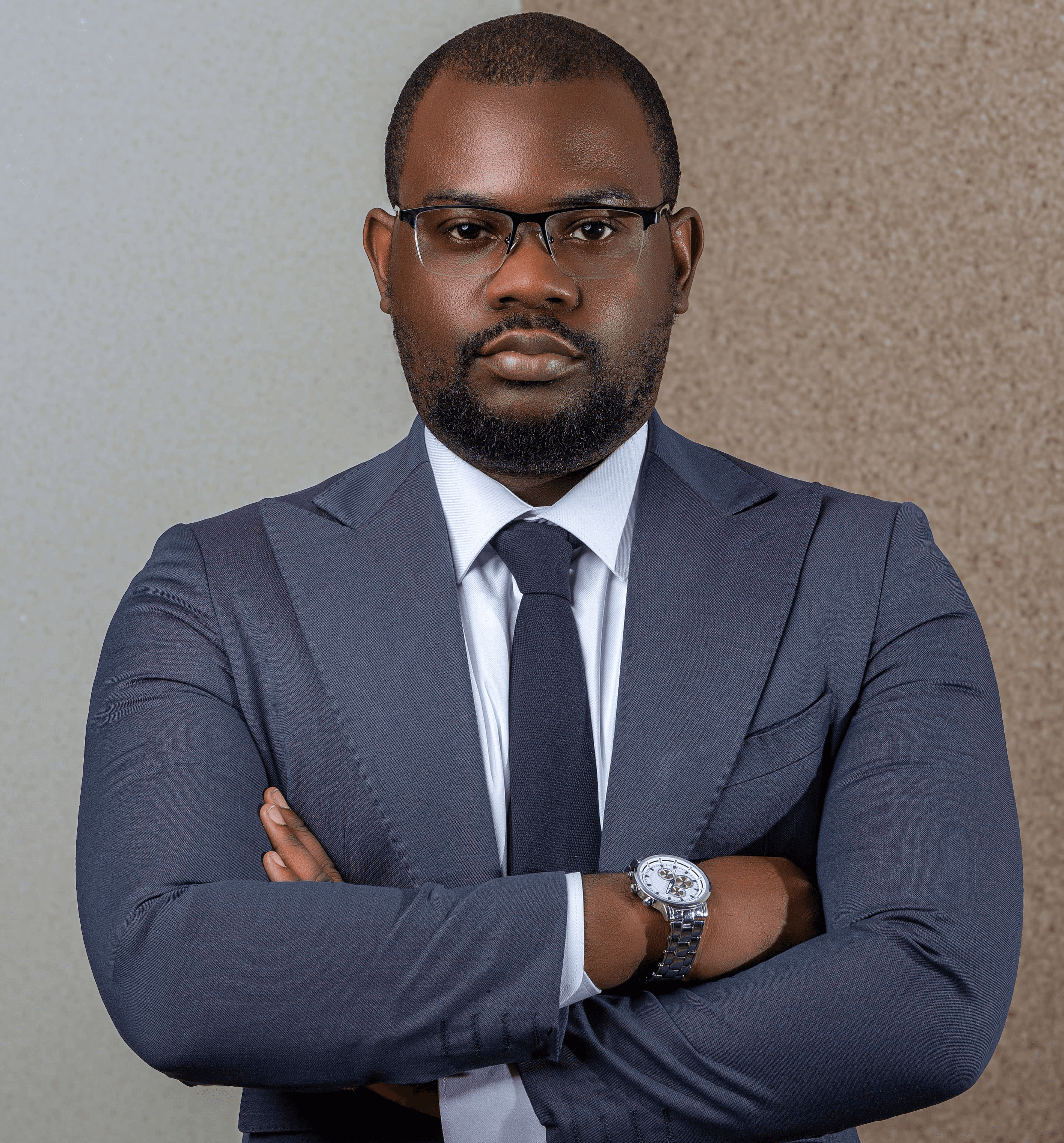 Professional headshot of a person in a formal setting.