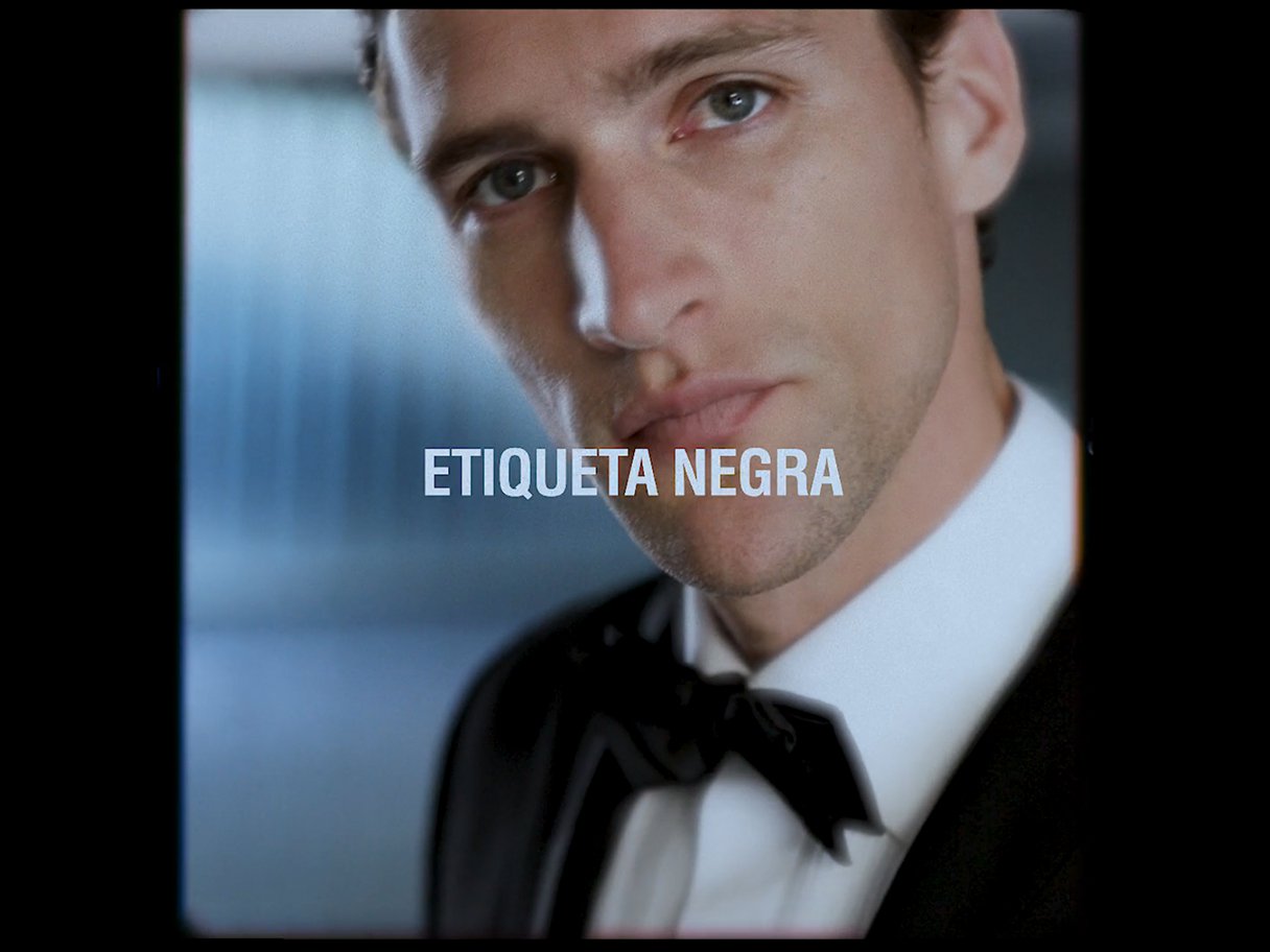 Rooftops of a coastal town with the sea in background