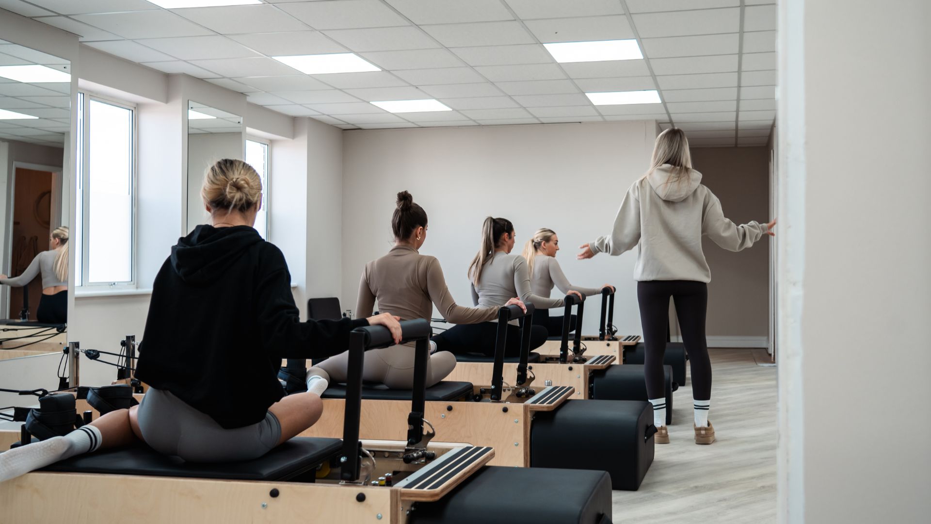 Reformer Pilates class led by Rise and Reform instructor.