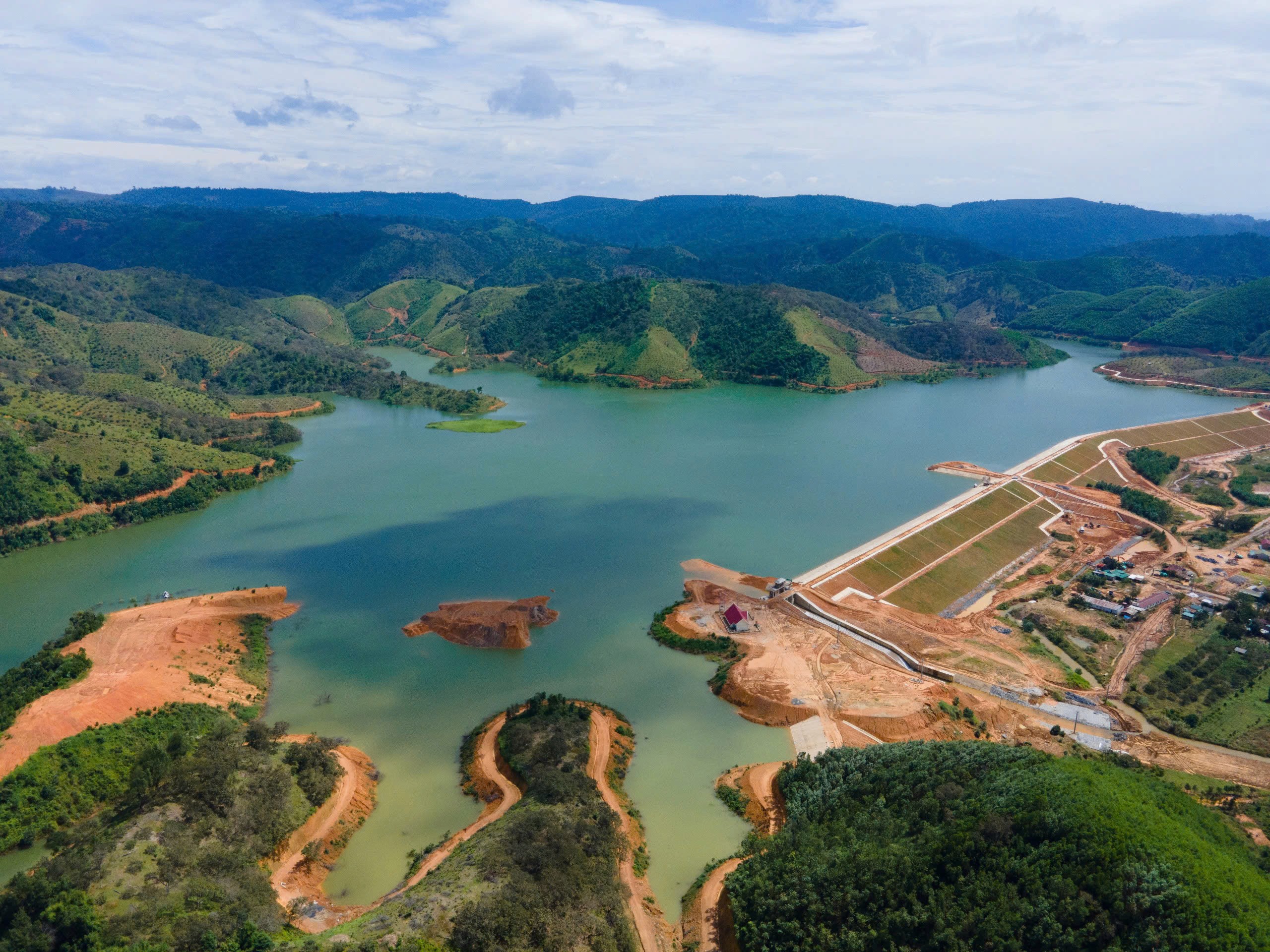 Construction workers review plans on site.