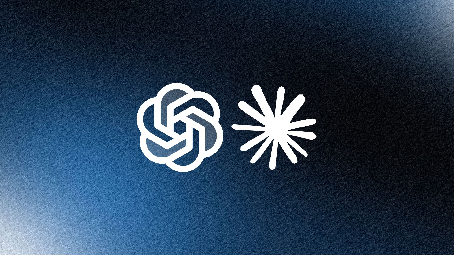 Two professionals standing confidently in front of bookshelves, both with arms crossed, in a softly lit office.