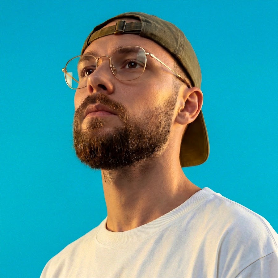 headshot of male in dark background