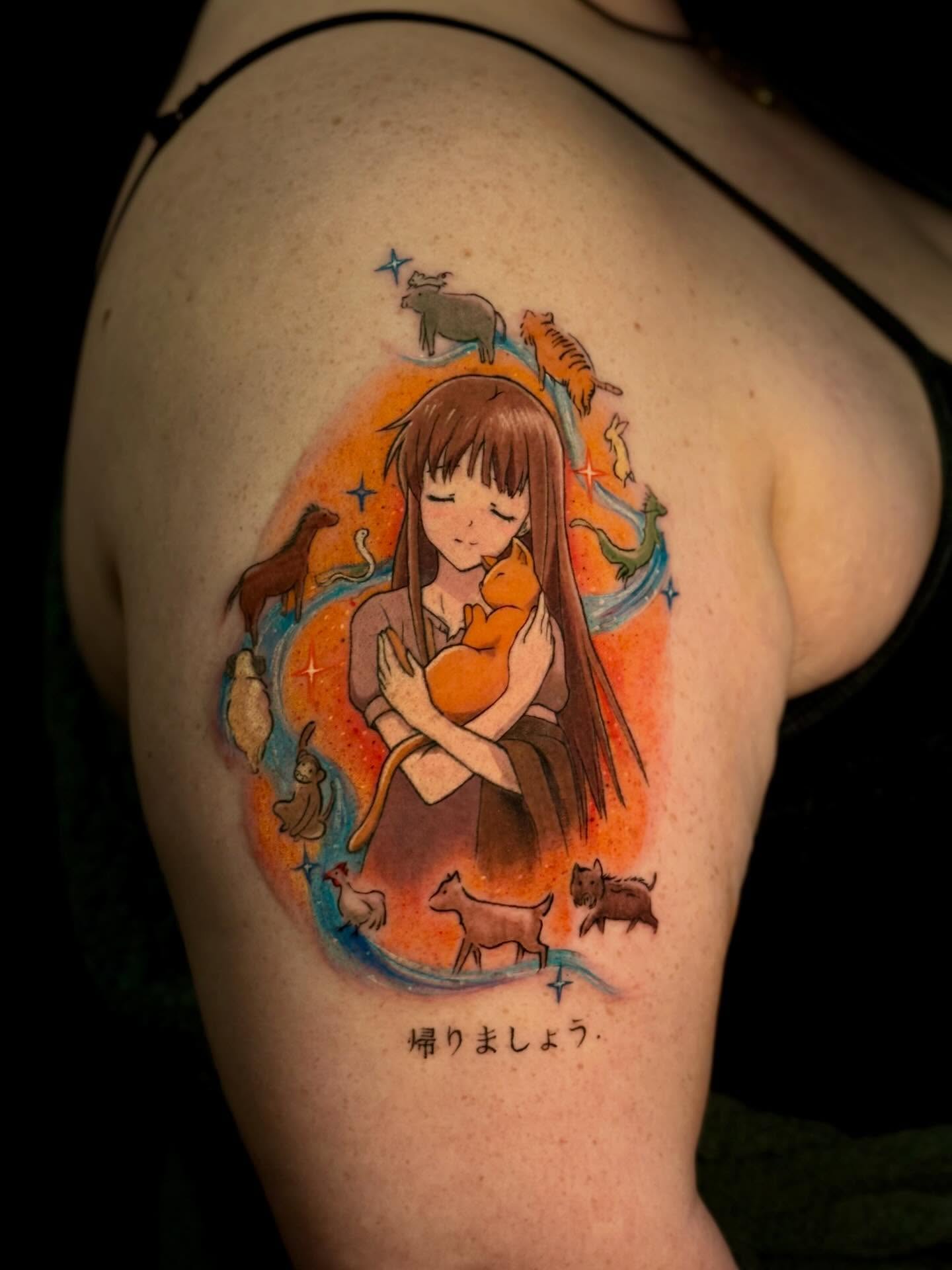 A forearm tattoo of Nezuko Kamado from Demon Slayer, depicted in a stylized anime art style. She is holding a sword.