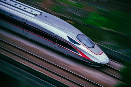 High-speed train travelling along railway tracks