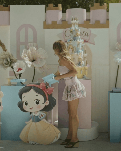 Pastel children’s party setup with a princess cake and Snow White decoration