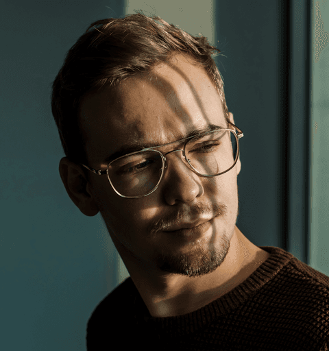 man wearing brown knit crew-neck sweater