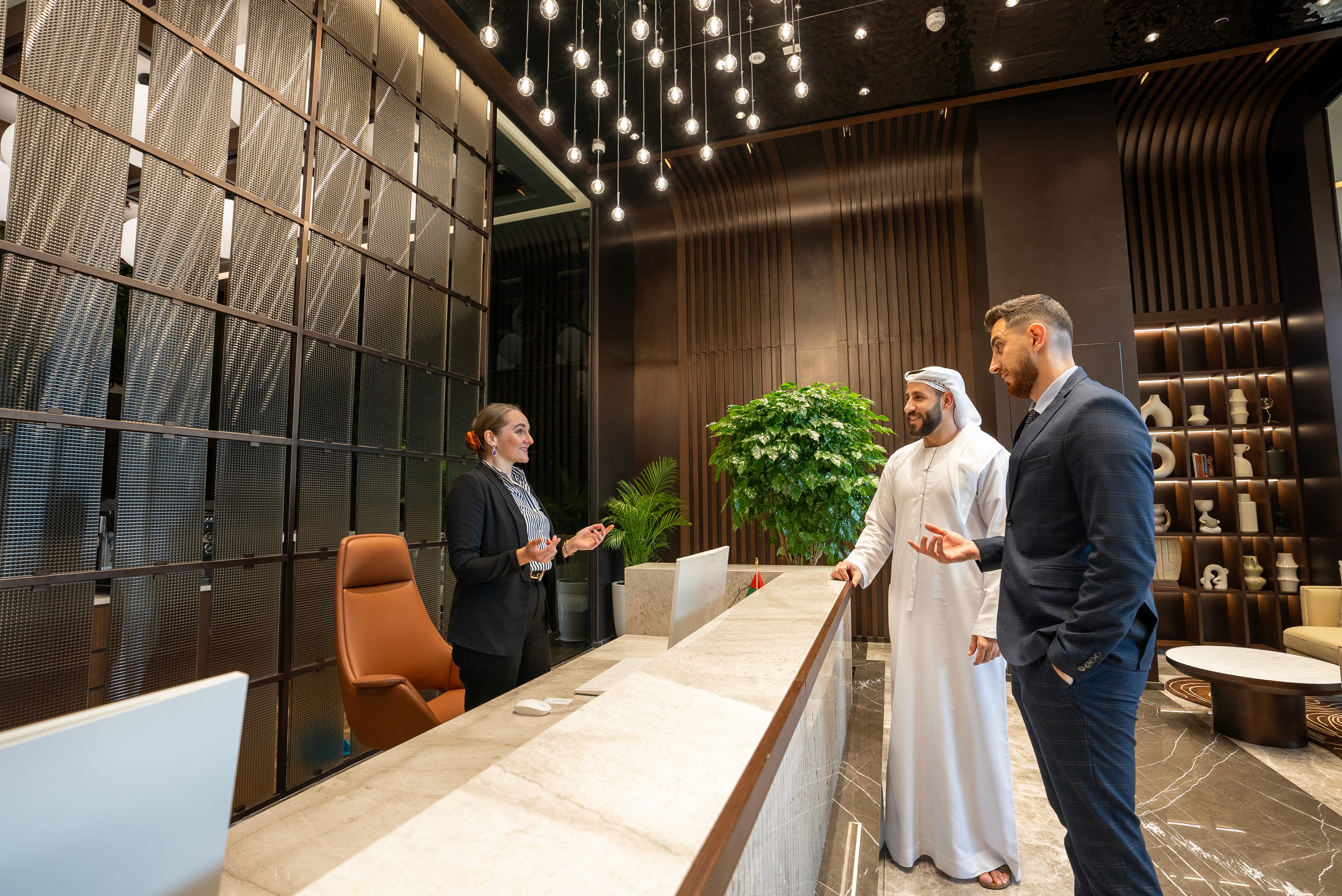 Reception team welcoming prospective clients at Office Square's premium business centre in Dubai.