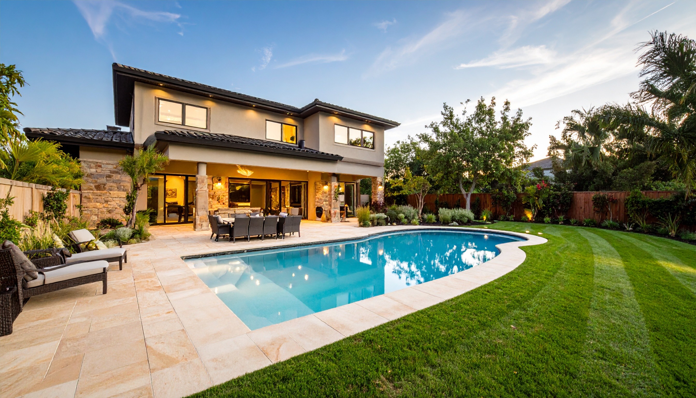 Villa with a swimming pool and a lawn