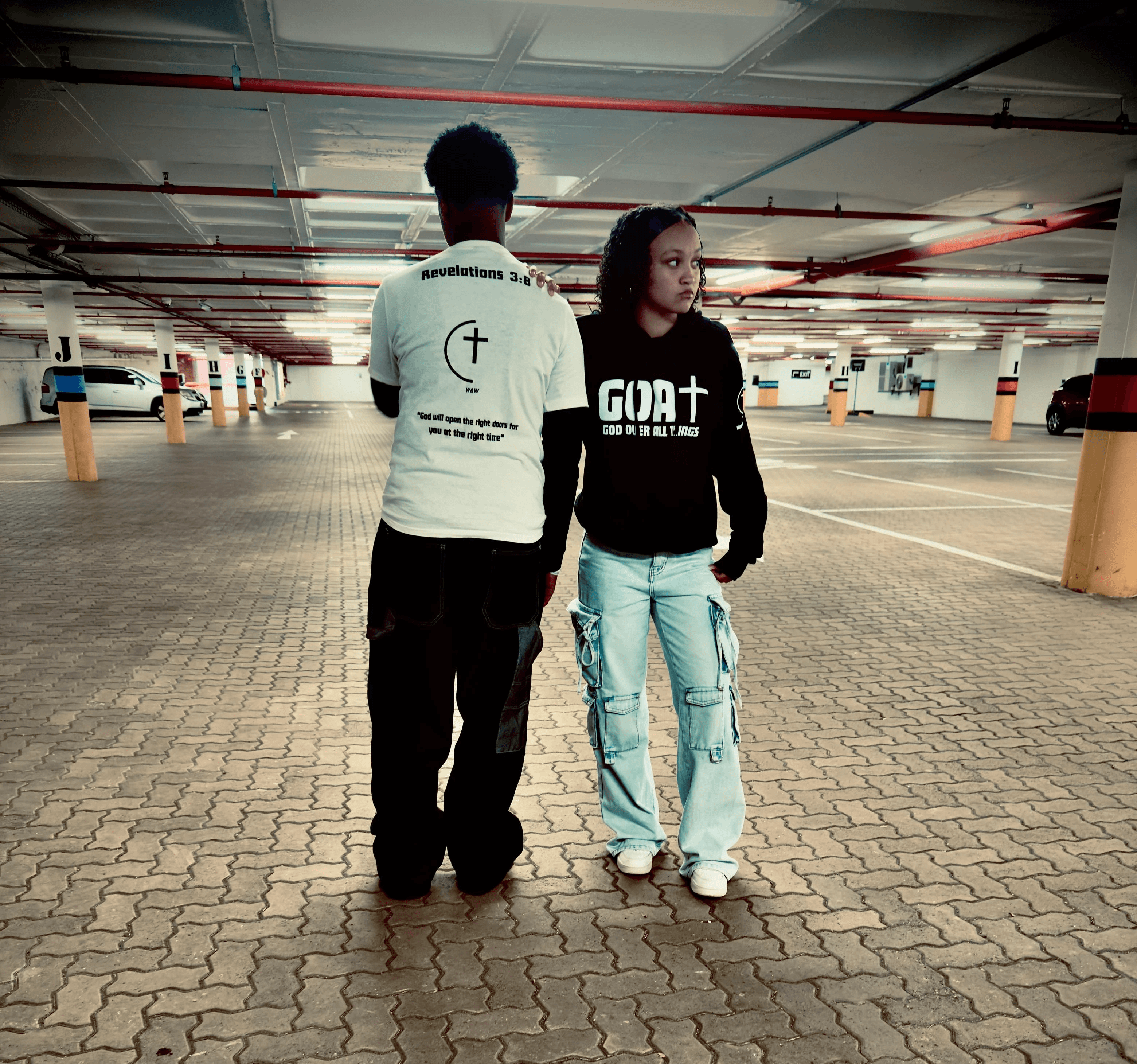 2 people showcasing brand clothes