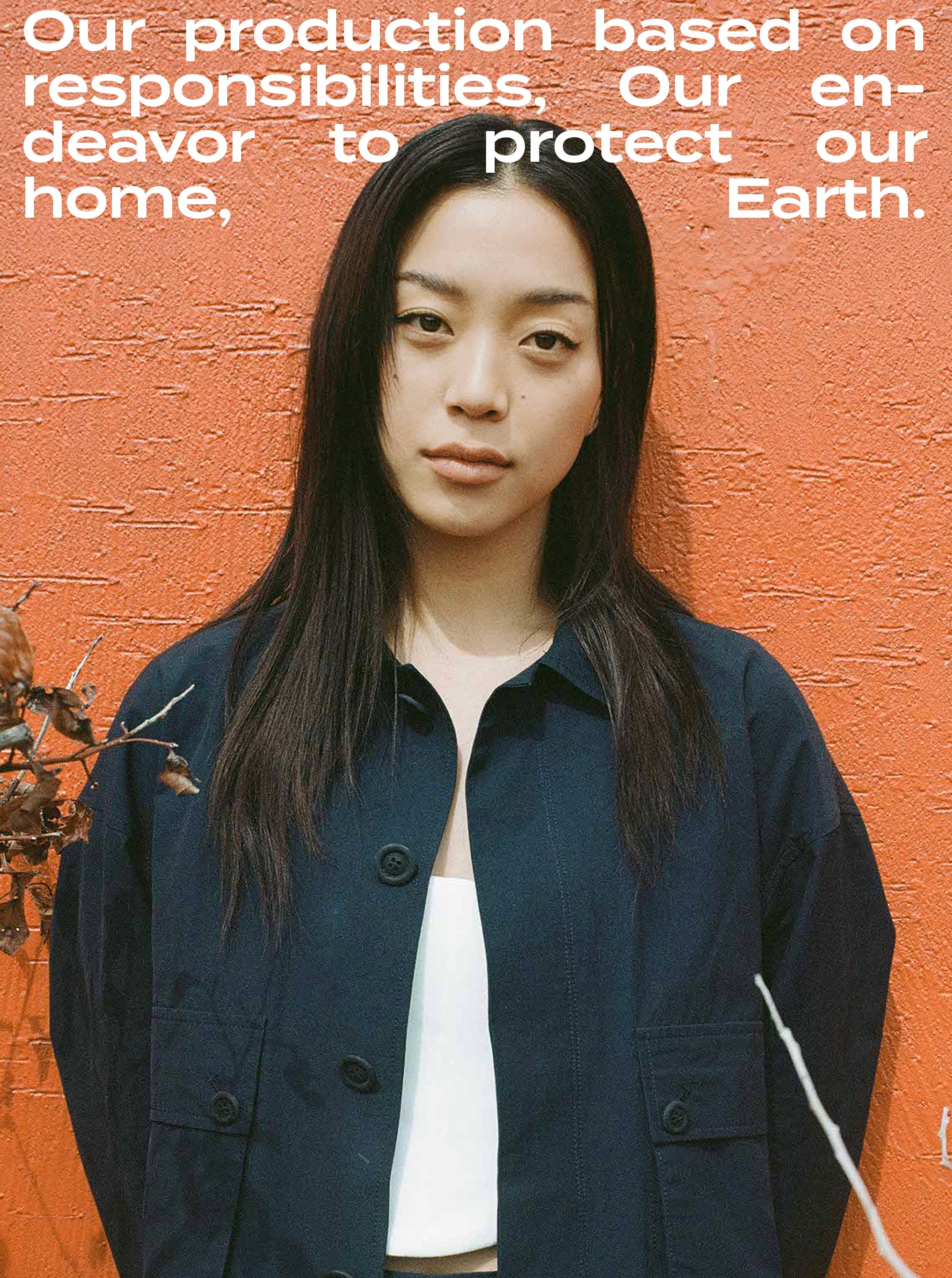 Minimal plant cutting with exposed roots in a clear glass bowl vase filled with water on a white background.