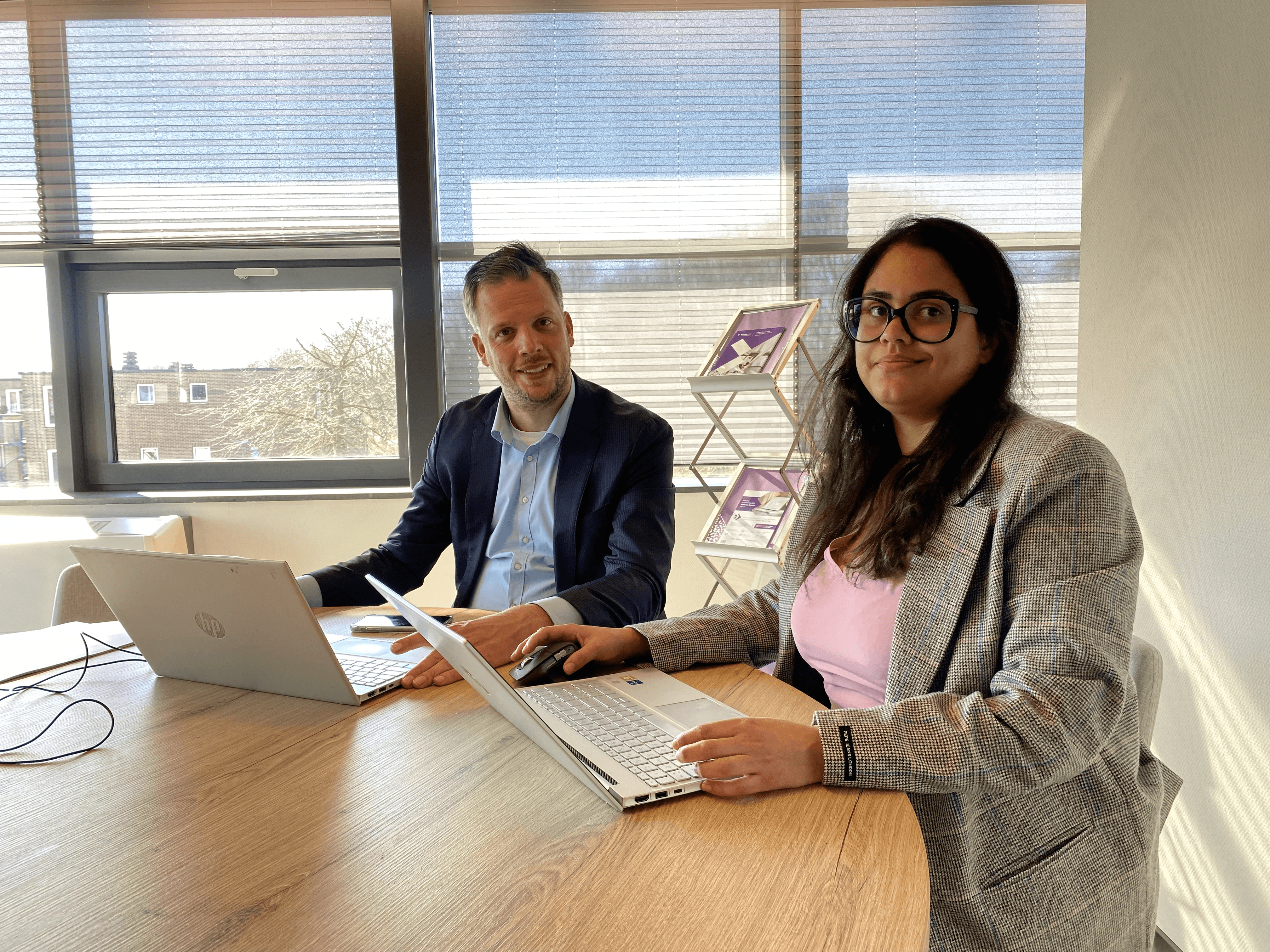 Exsion365 consultation meeting at a desk