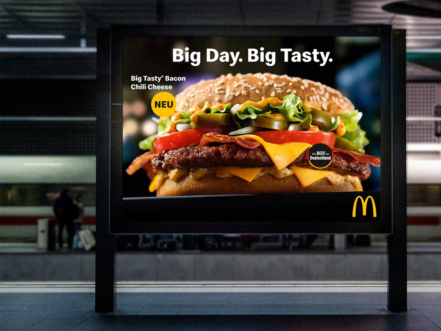 Advertisement poster for a fast-food restaurant showcasing a large burger and text about a "Big Tasty" meal.