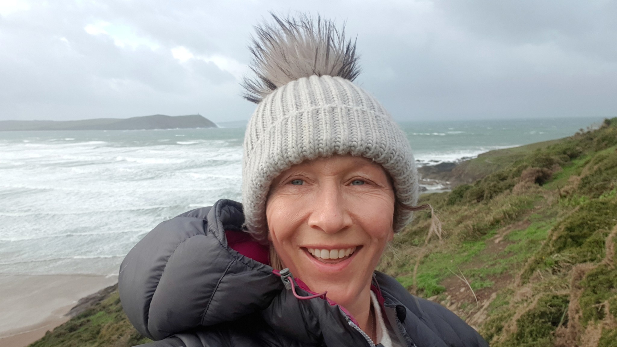 Heidi smiling on a windy walk