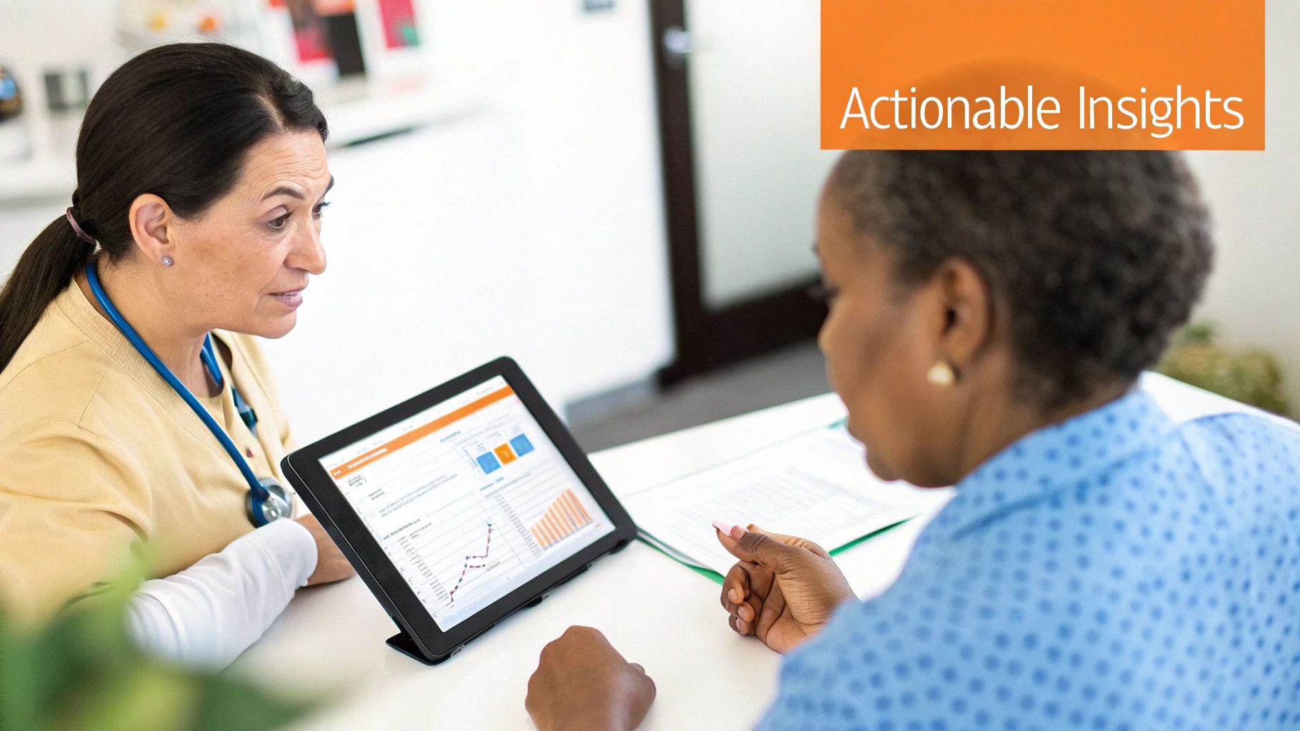 A healthcare professional discusses mental health data on a tablet with a patient, offering actionable insights.