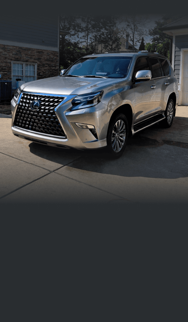 1985 Porsche 944 sitting in a parking lot at night.