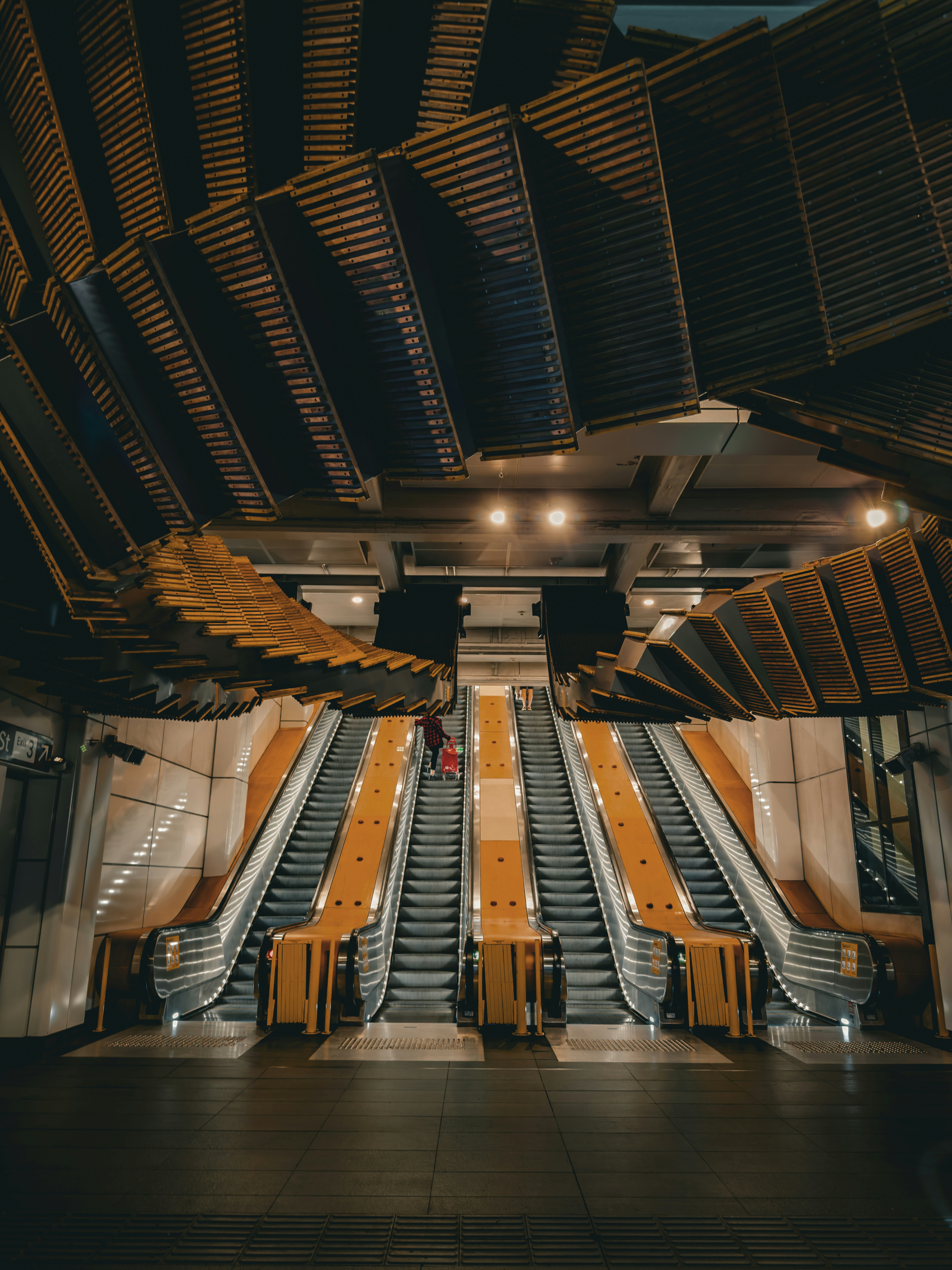 Escalators with unique wooden ceiling design