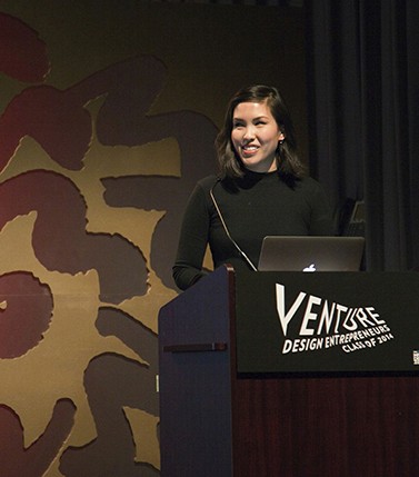 portrait of a woman dress in black is who is giving a speech