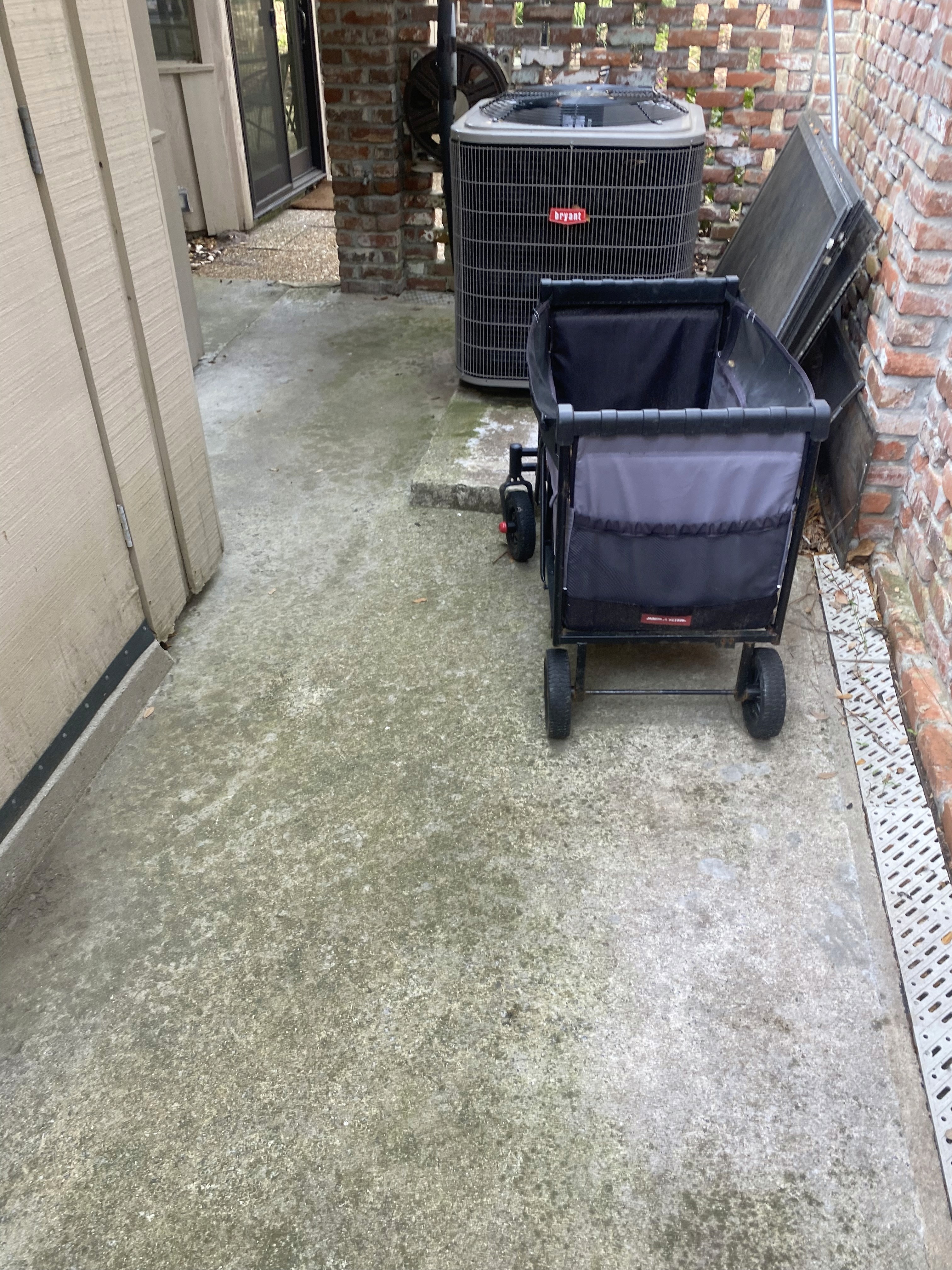 Before and after—home siding soft washed, surface free from algae and grime