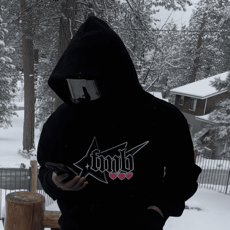 smiling woman wearing white and black pinstriped collared top