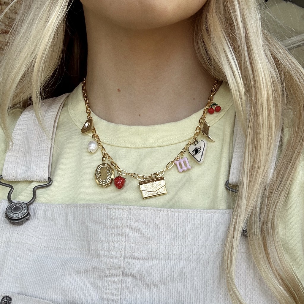 woman wearing charms on necklace