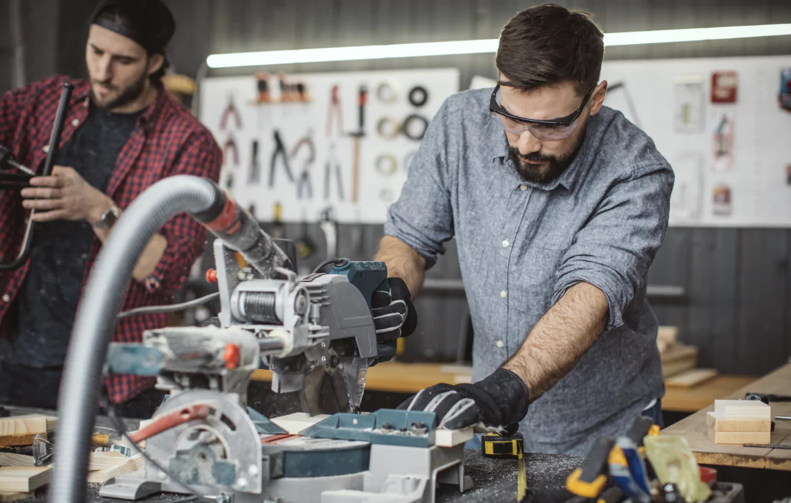 a man cutting a product and a man assembling a product