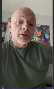 Sara is a client smiling to the camera happily