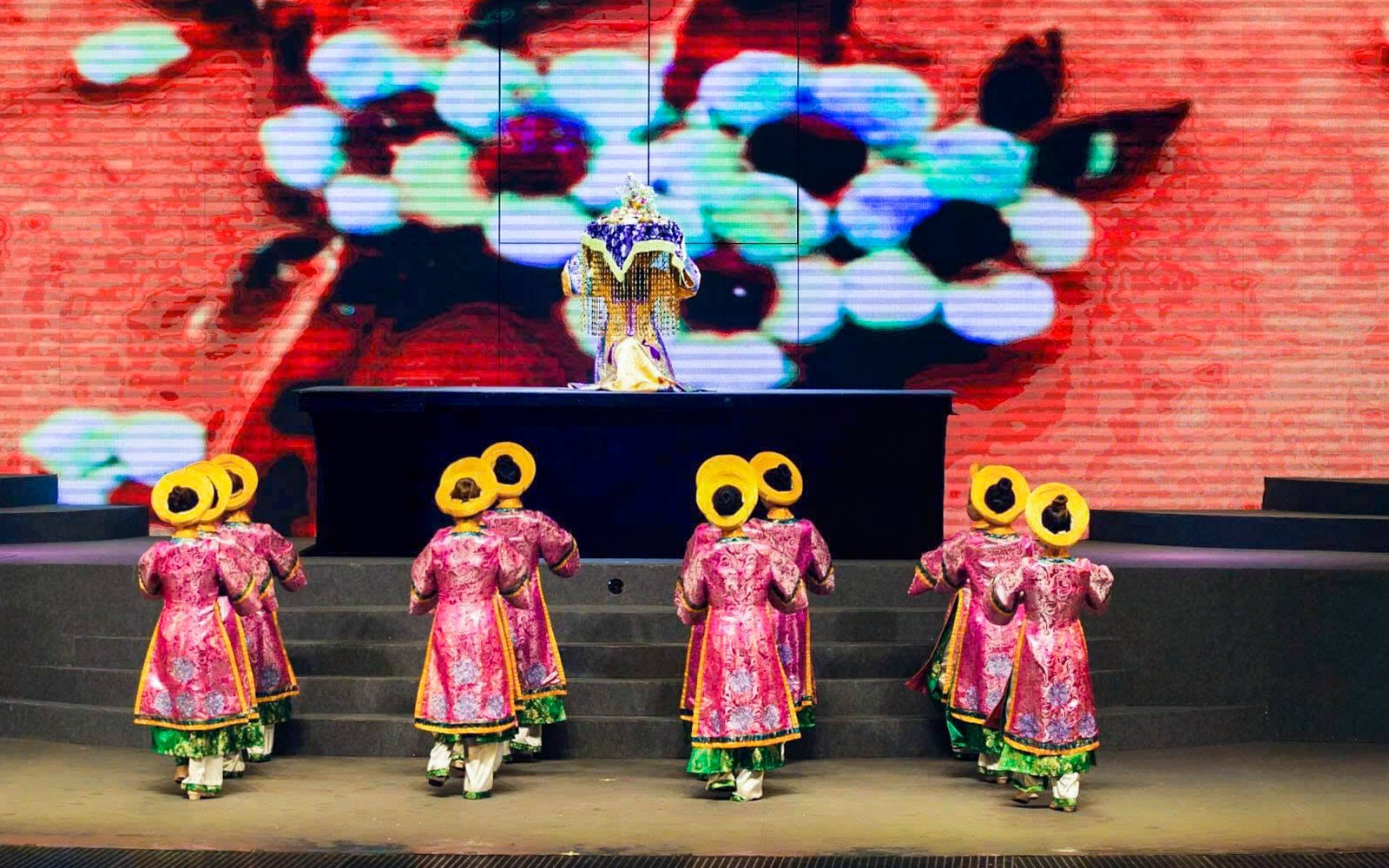 Performers in traditional costumes on stage at Charming Danang Show, Da Nang.
