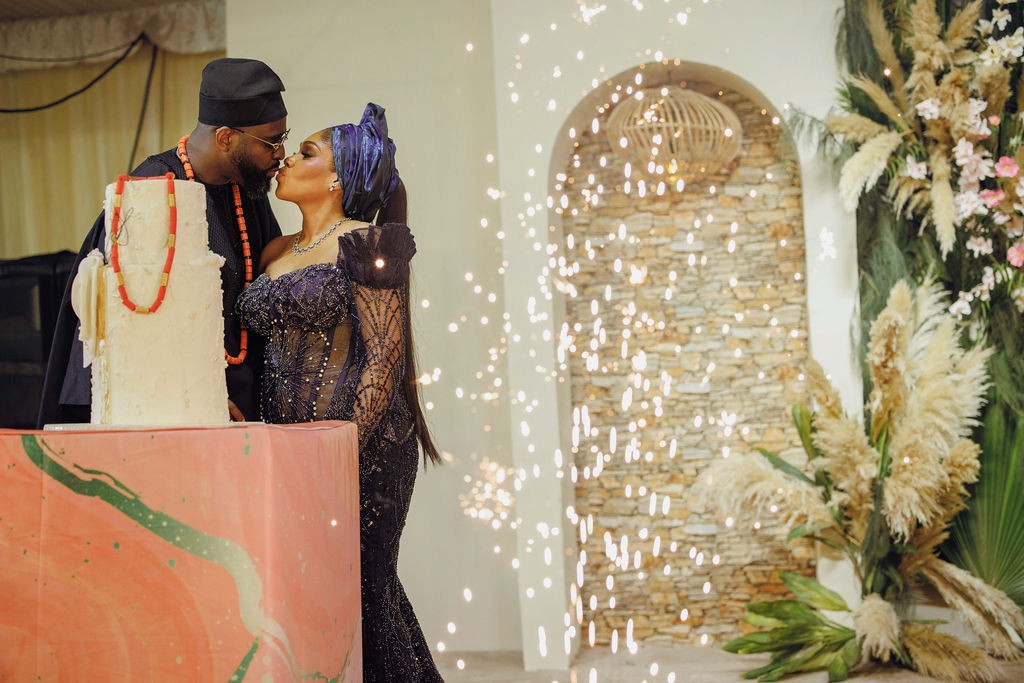 Bride and groom celebrating a luxury wedding coordinated by Victoria Brooks Events, a premium wedding planner in Nigeria. with family and friends