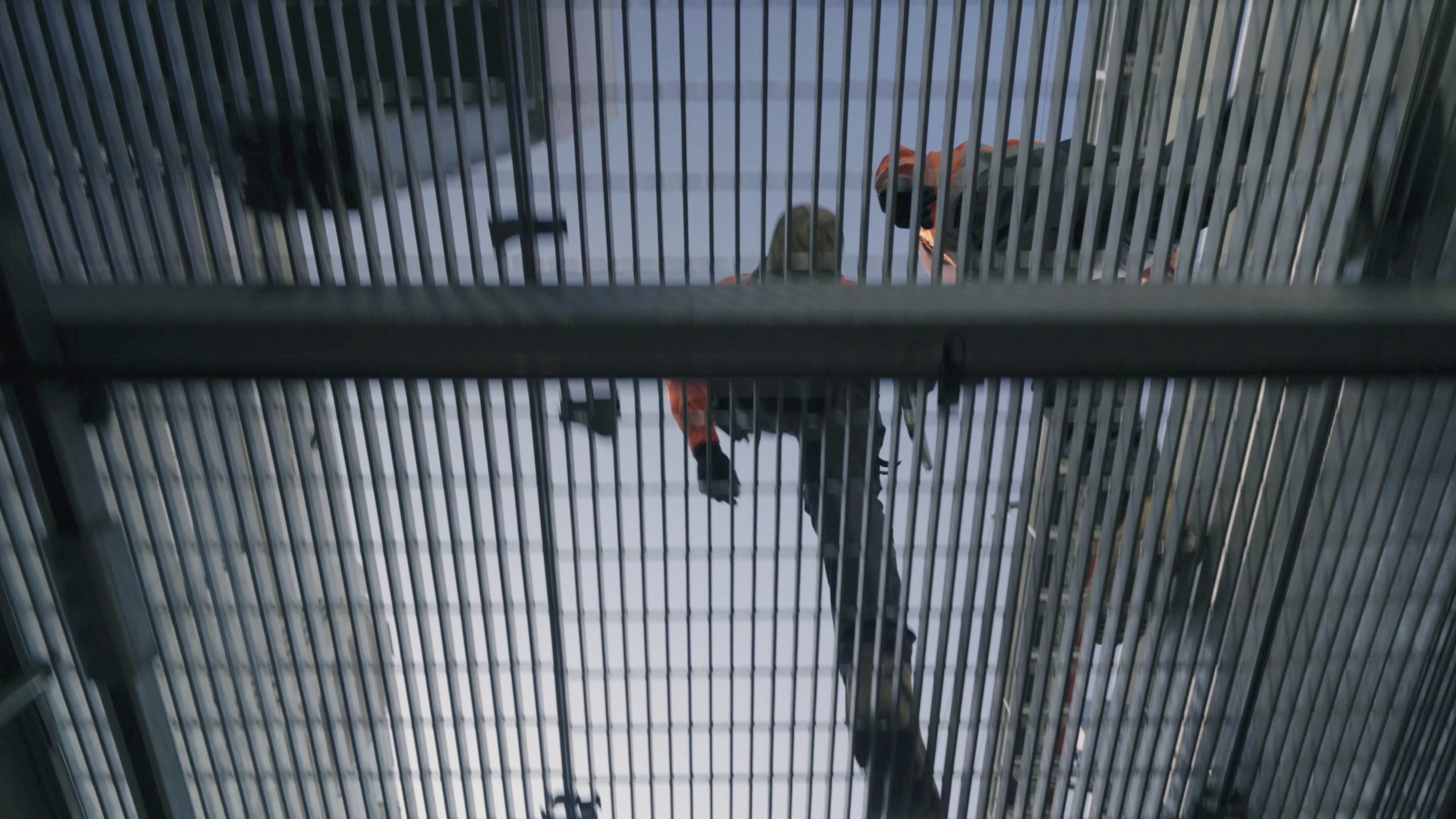 men walking overhead