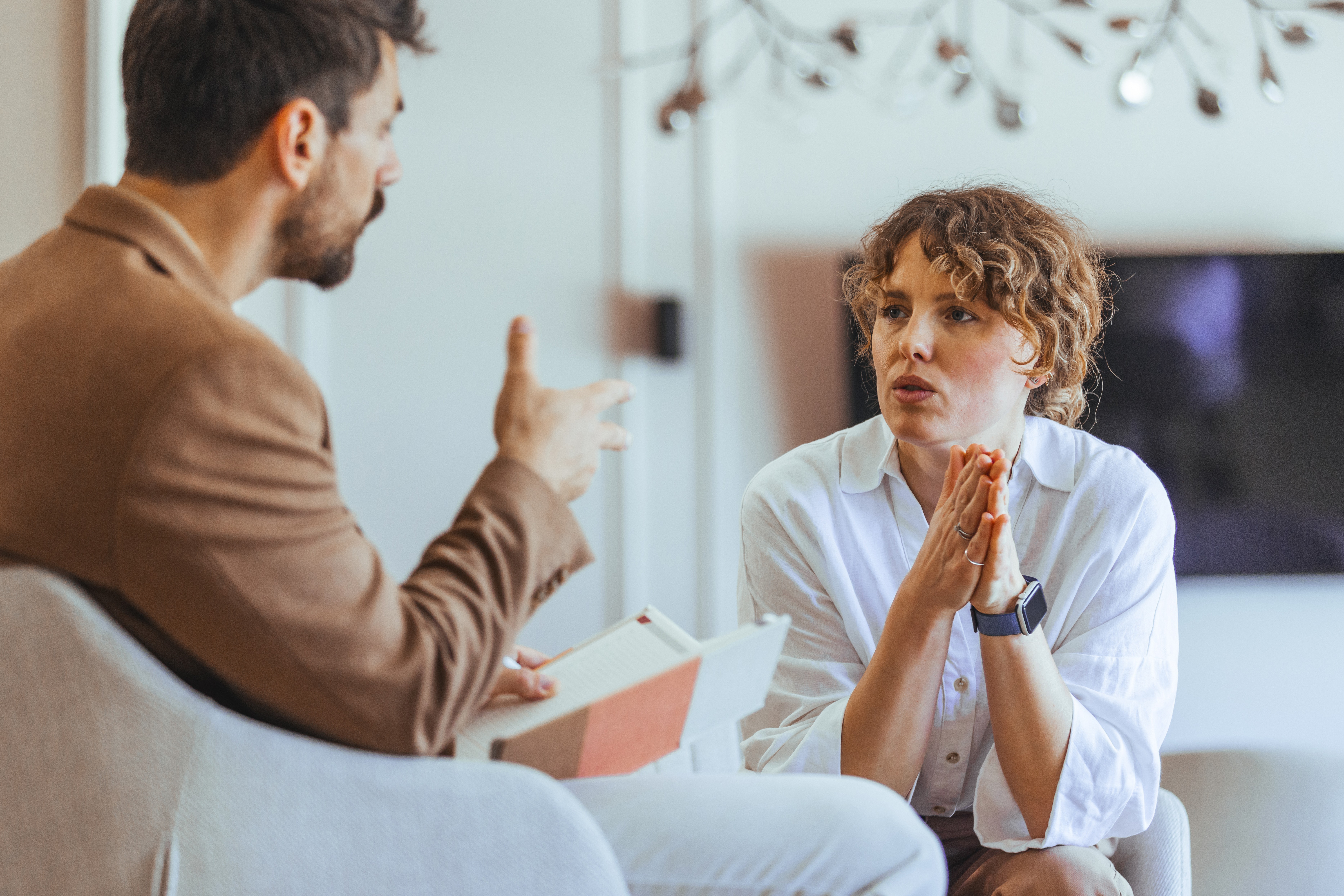 Two co-workers discussing an issue