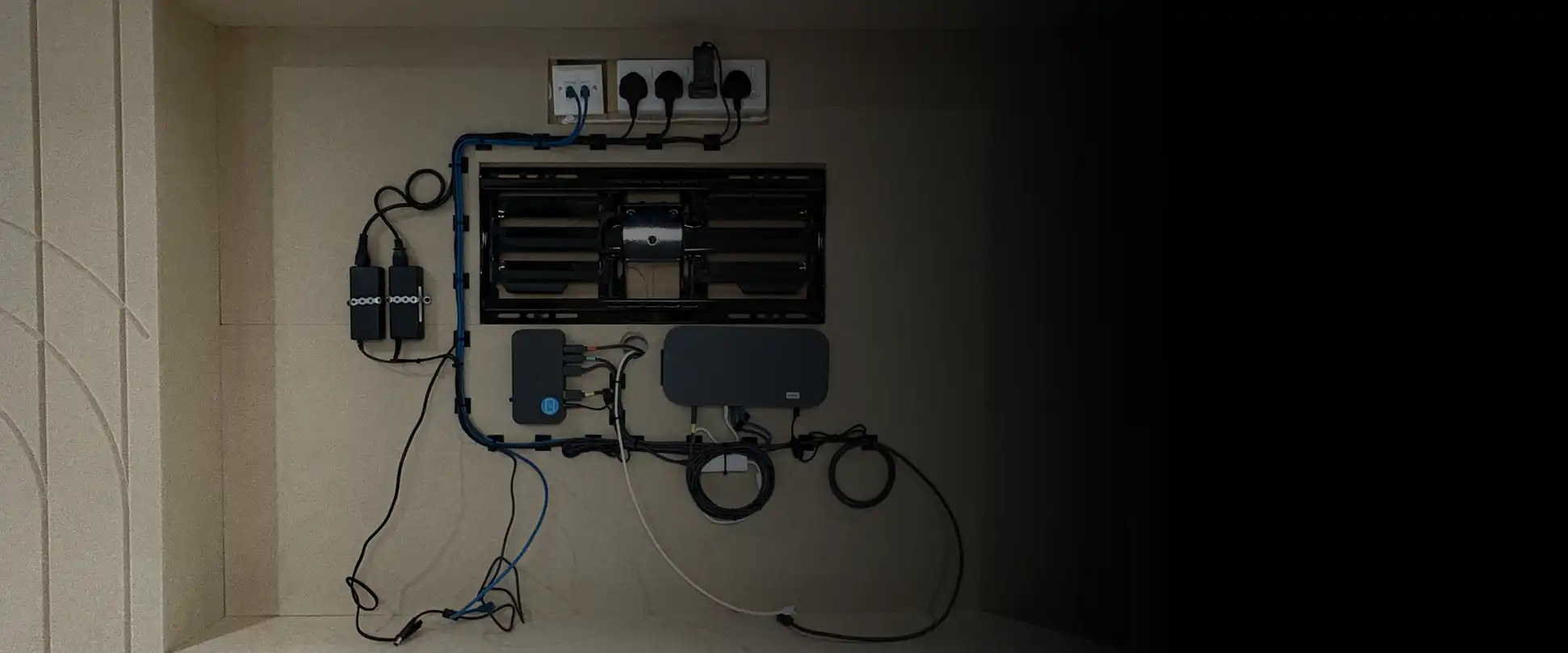 Wall-mounted AV equipment and structured cabling during installation