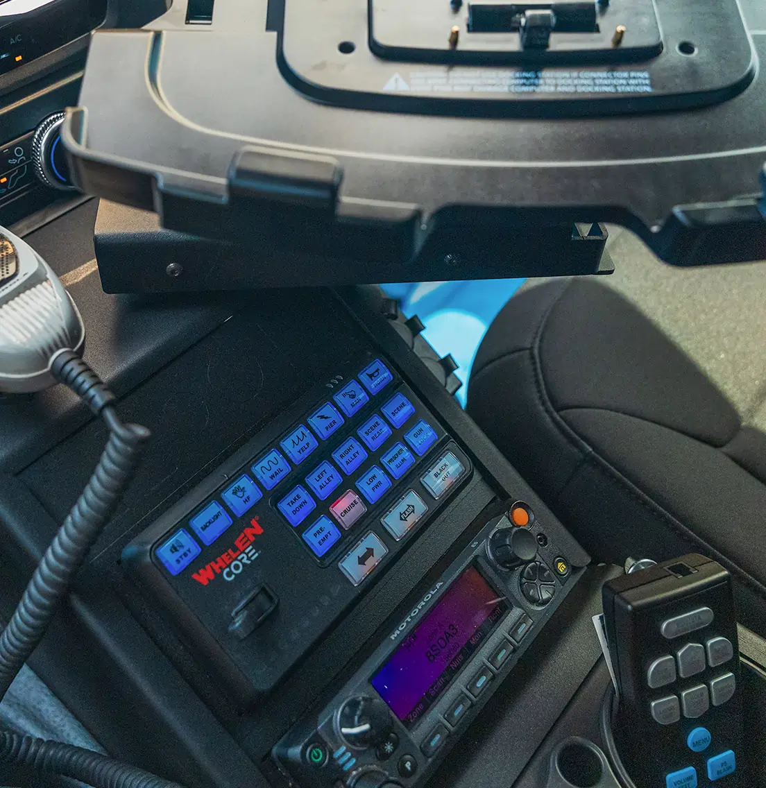 Patrol vehicle interior equipped with mobile computing and emergency lighting controls