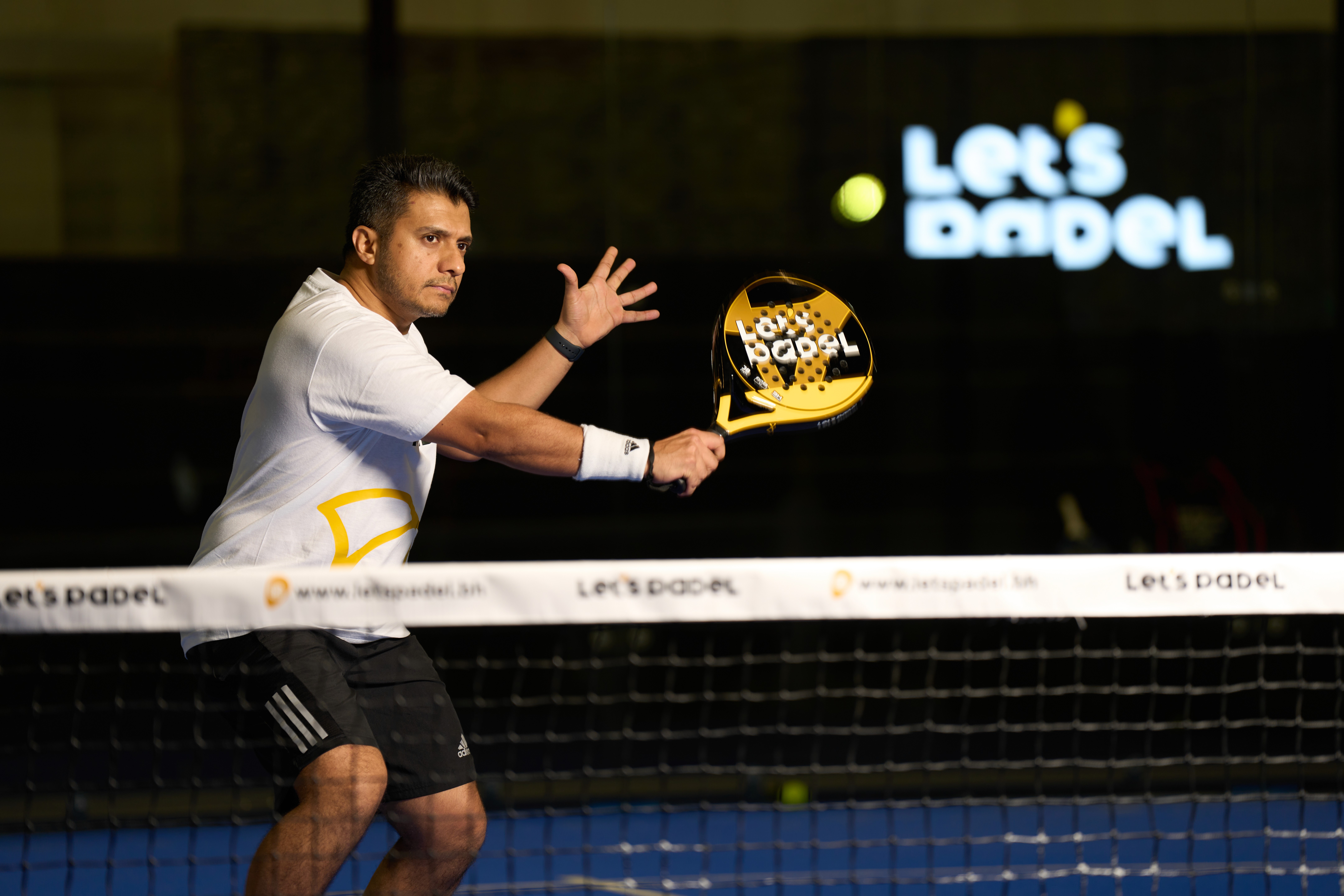 Drone shot of a running track at night