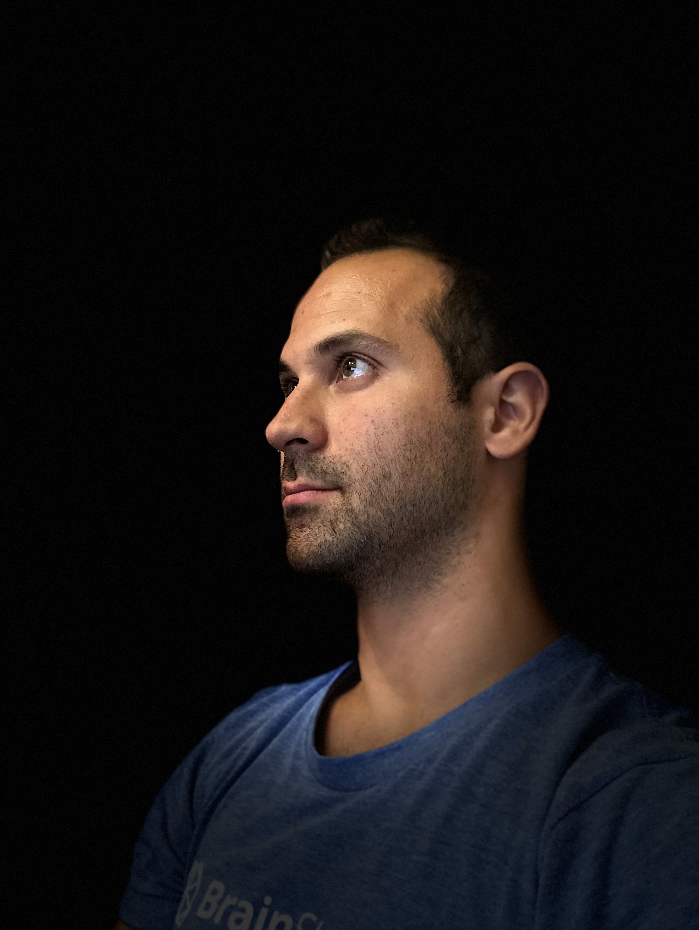 An angled headshot of Rocco