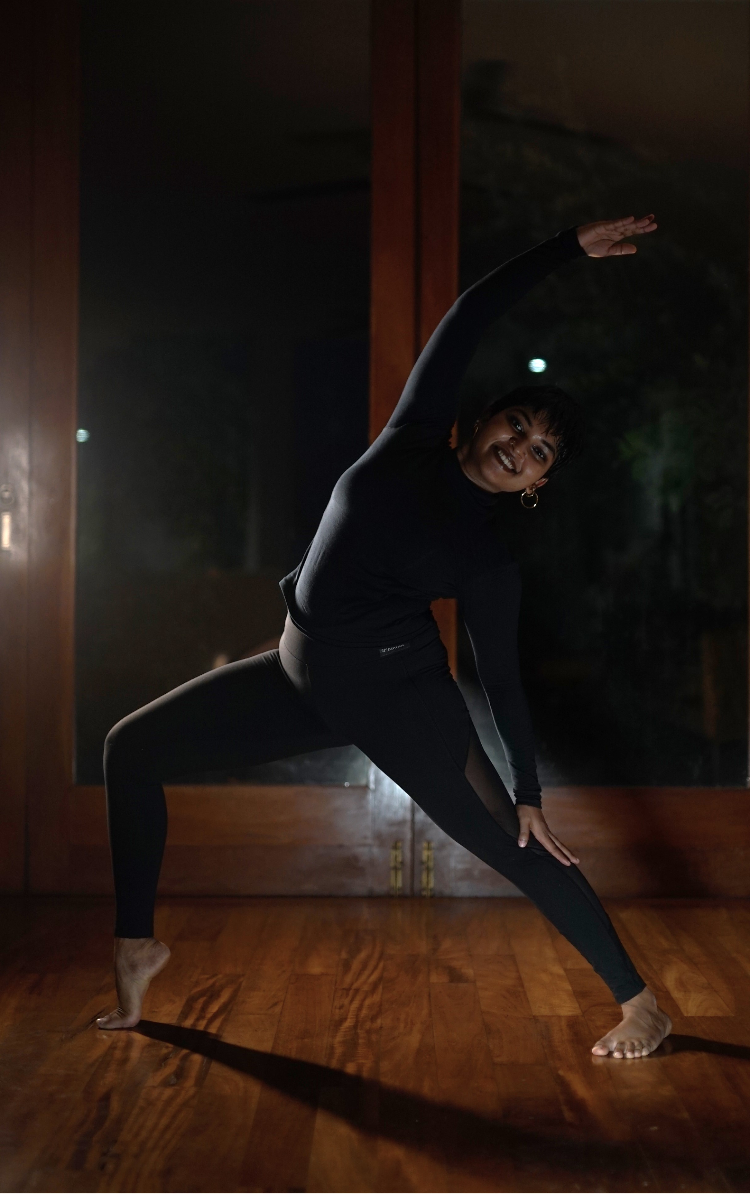 A man playing a drum in front of a group of people