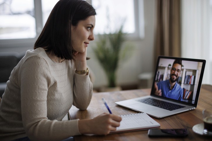 Business owner on video call with business coach