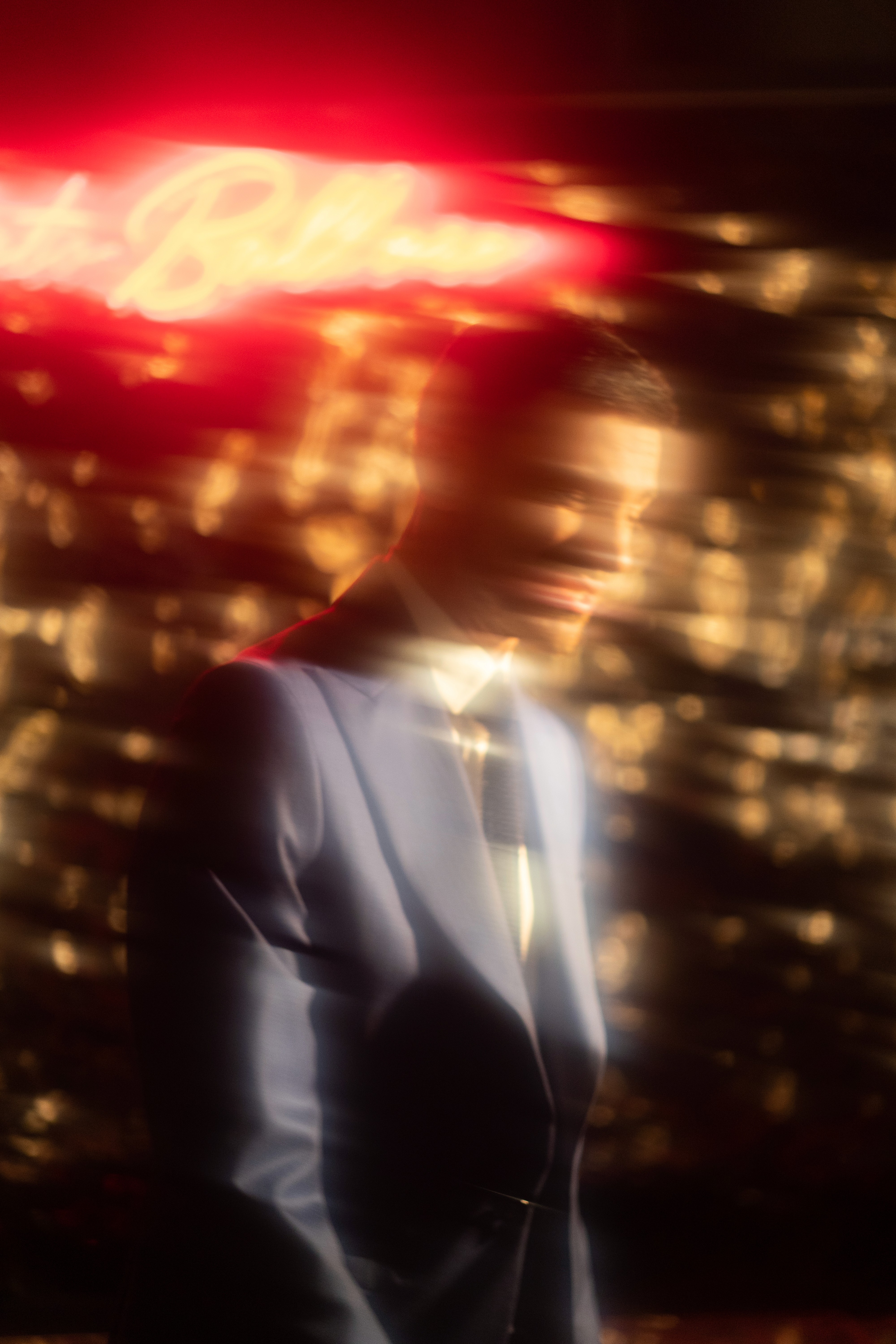 person holding black ipad with green plant