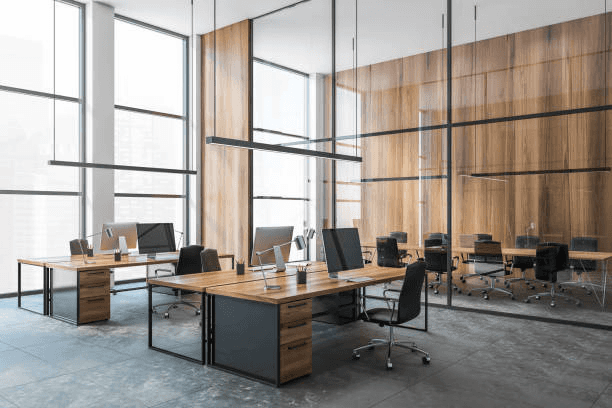 An office space with neat, tidy desks, cleaned up by the MVP Cleaning team