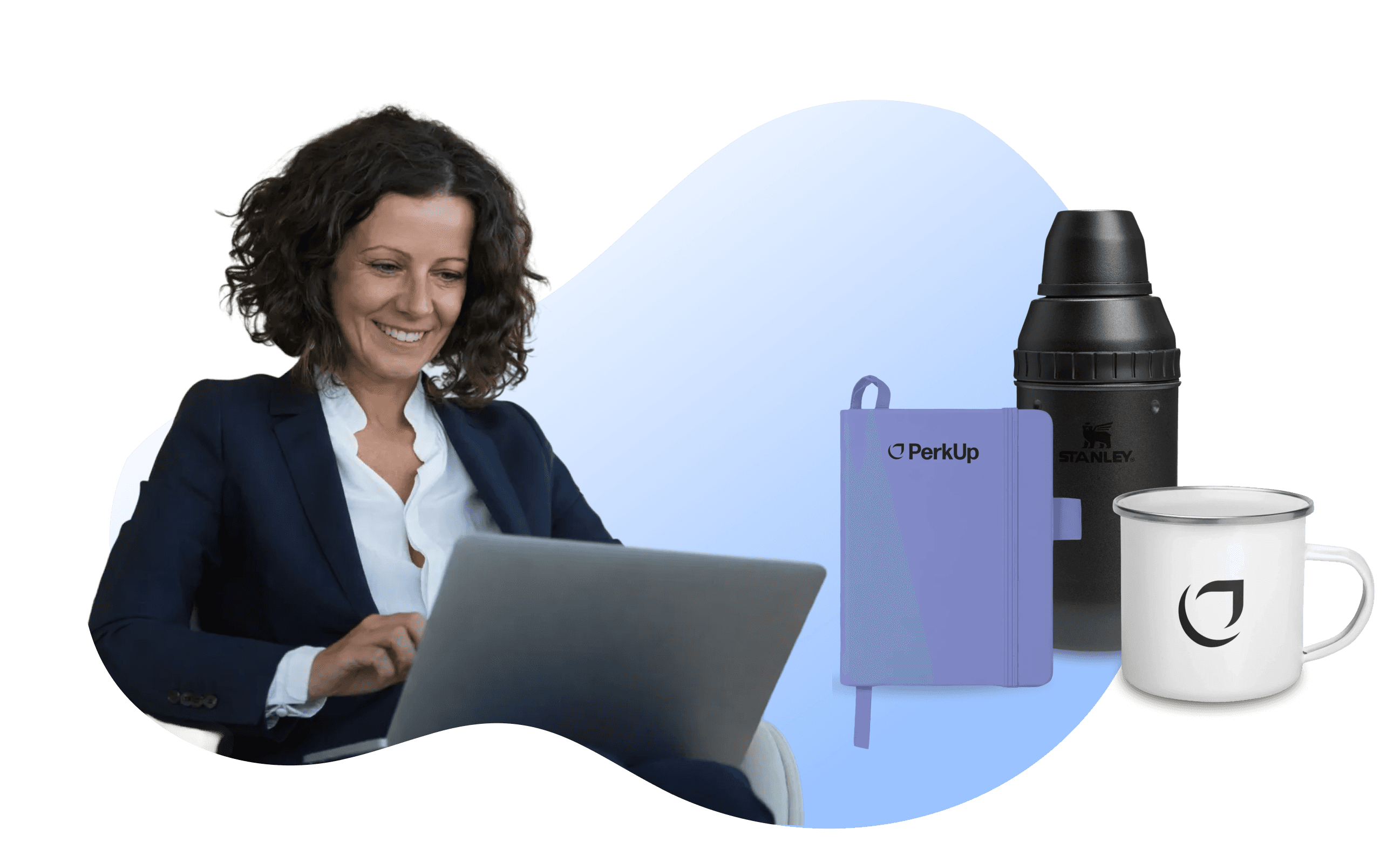 A woman looking at a laptop with a notebook, cocktail shaker, and a mug on the right side.