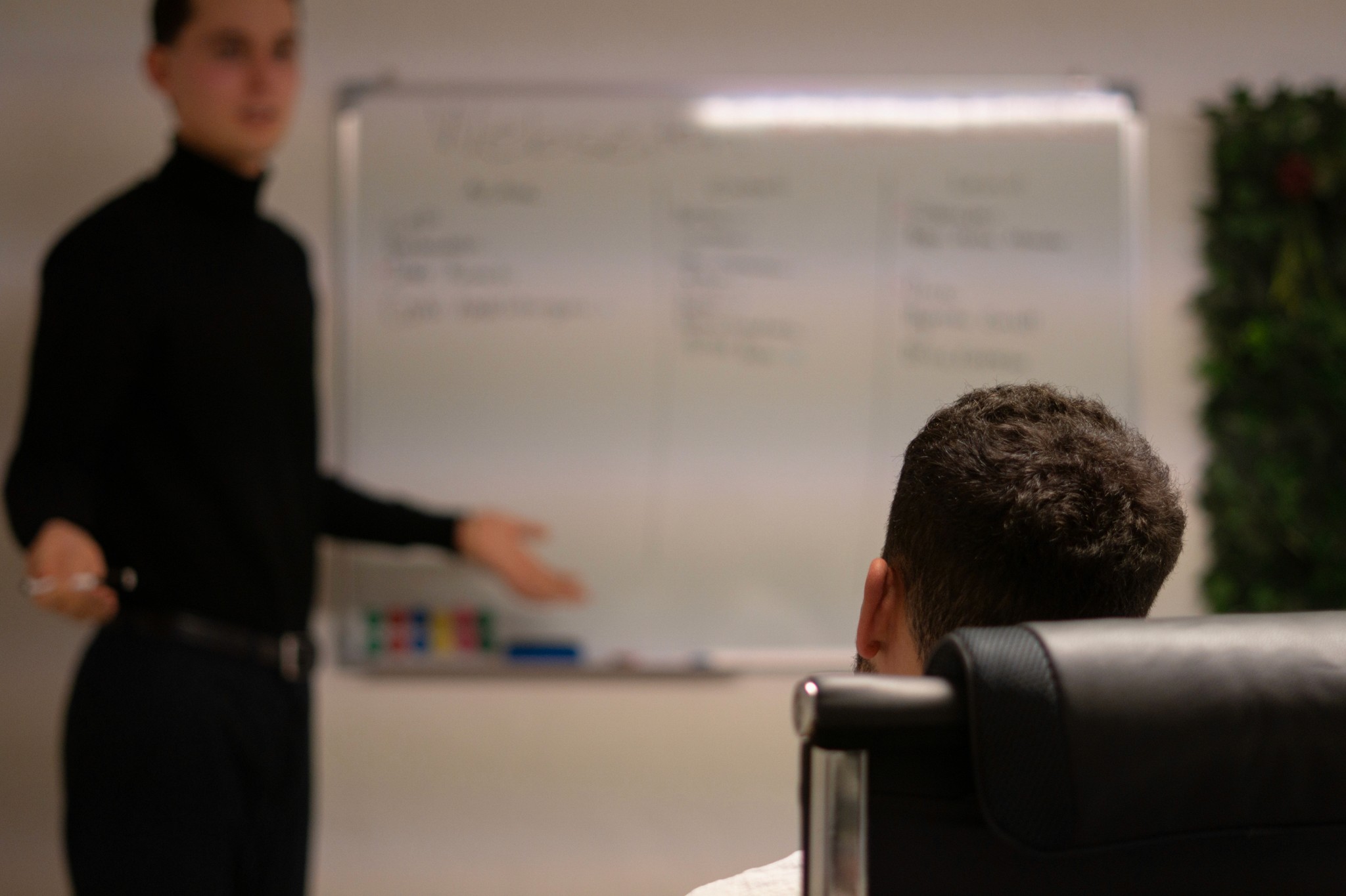 Vibrant purple and blue gradient paint splashing against a black background.