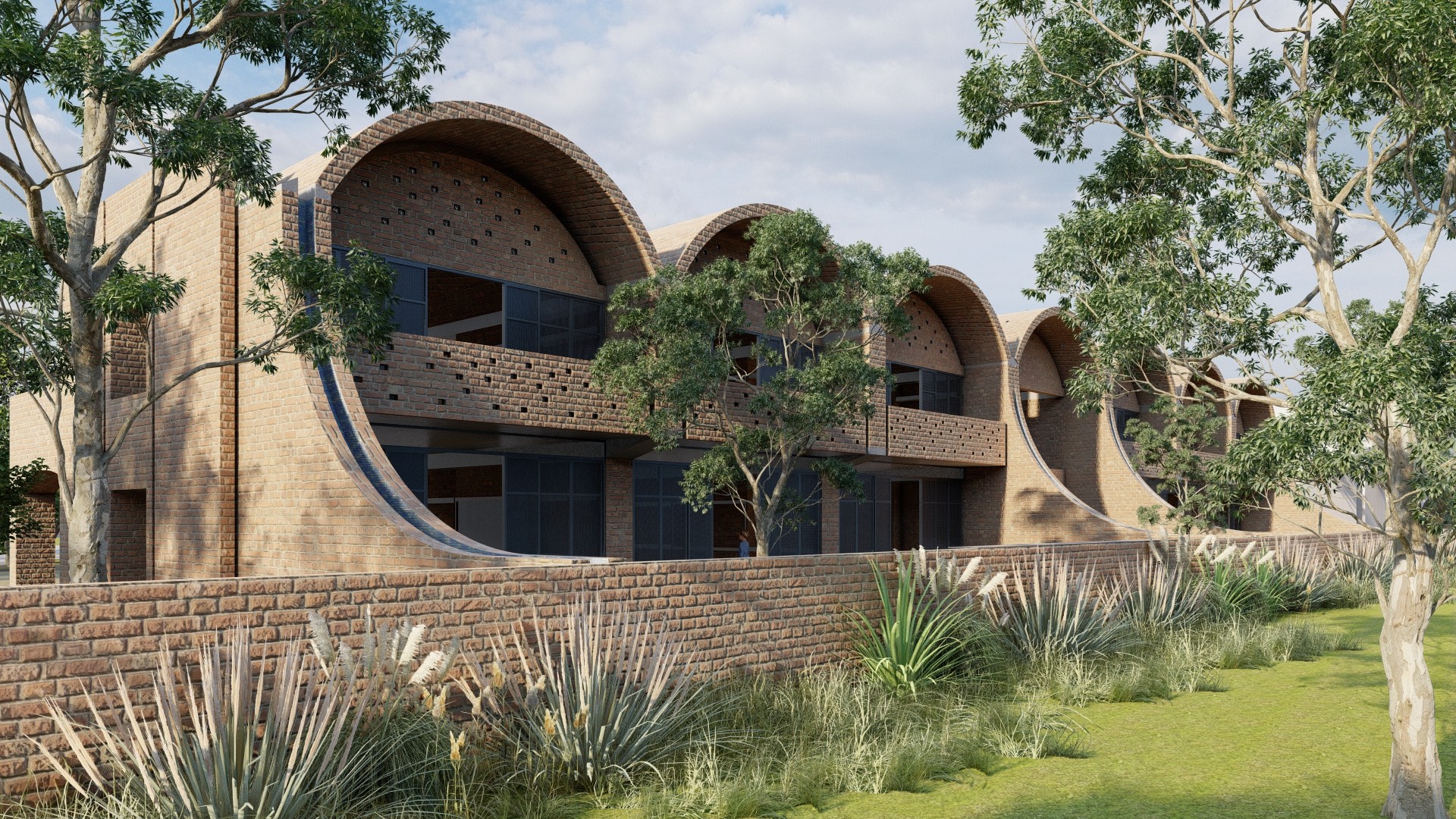 A low building with a row of vaulted brick roofs and perforated brick walls, a tall eucalyptus tree in the courtyard in front.