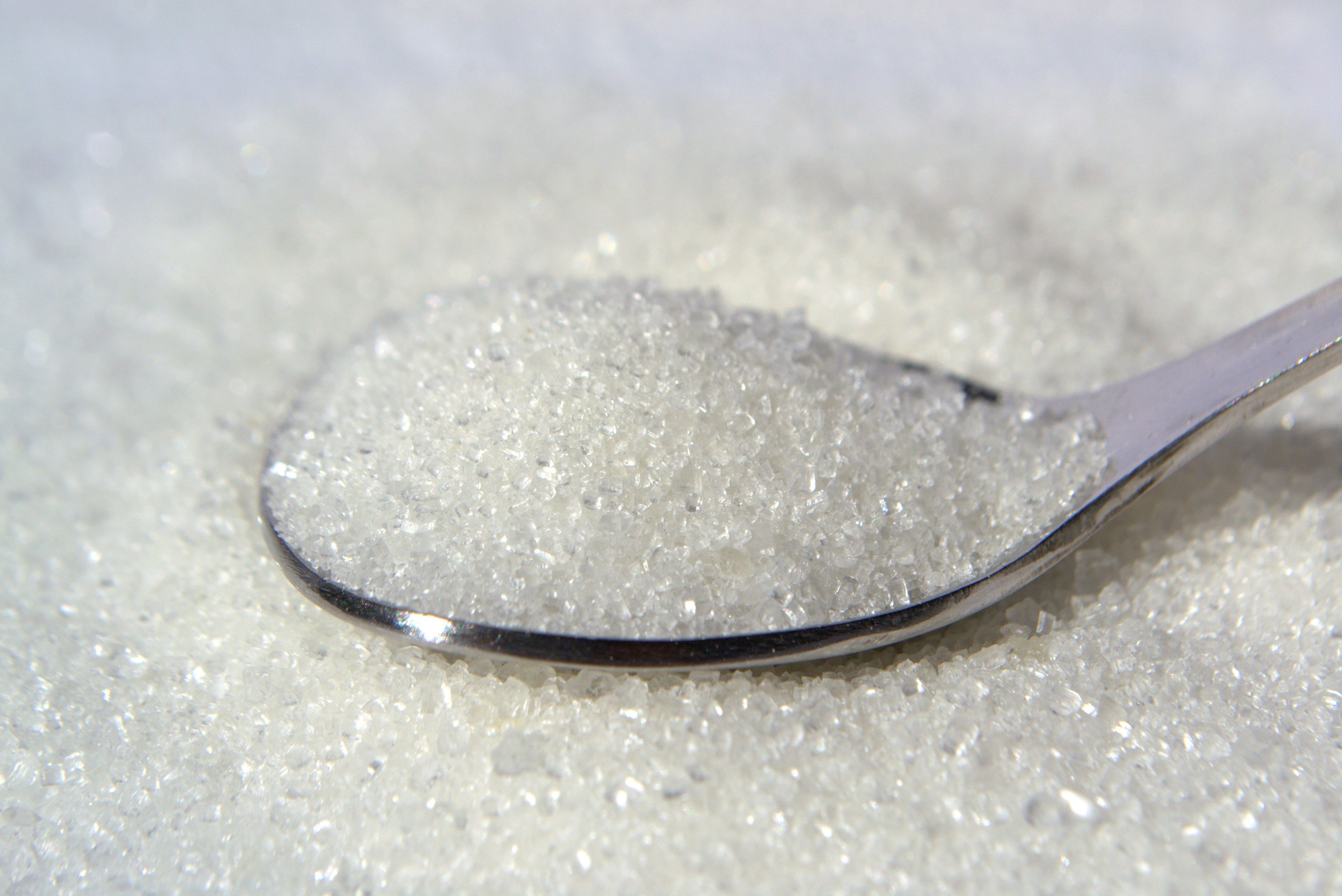 a bowl of flour sitting on top of a table