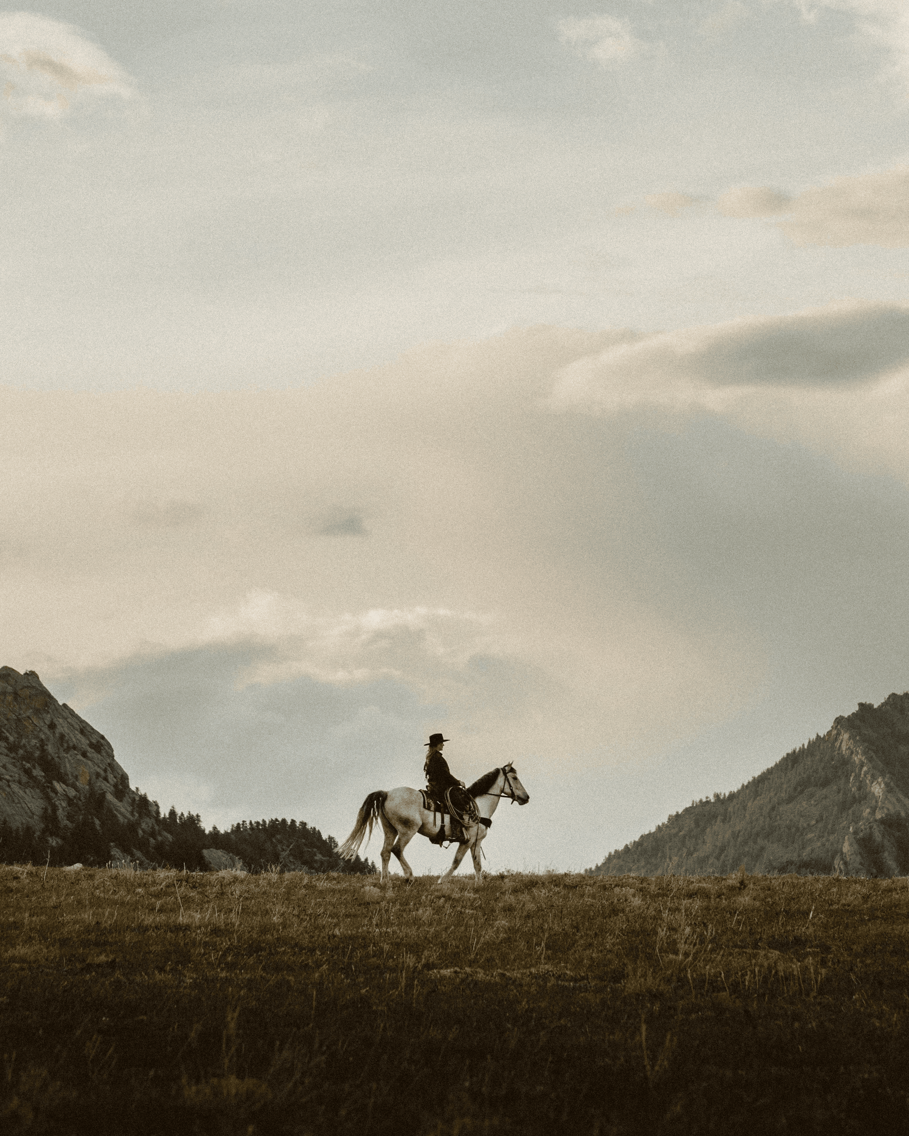 White distressed smiley face logo (X eyes, tongue out) centred on a solid black background, showing rough, hand-painted edges.