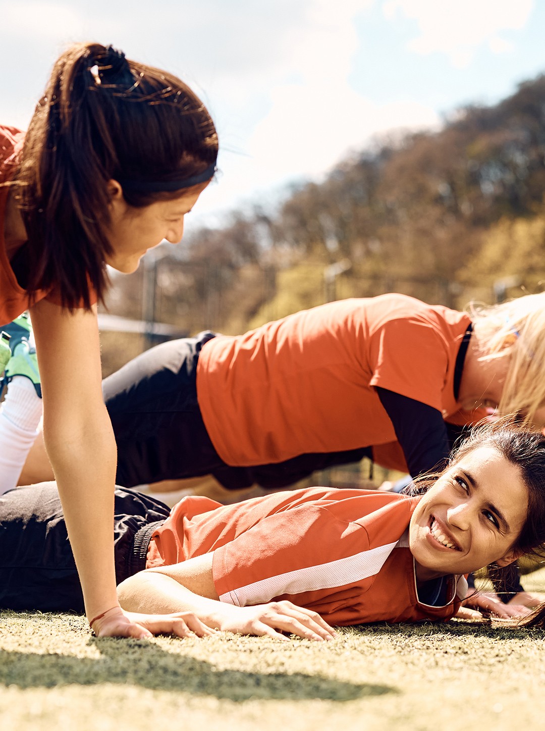 Hand holding a smartphone with colorful app icons.