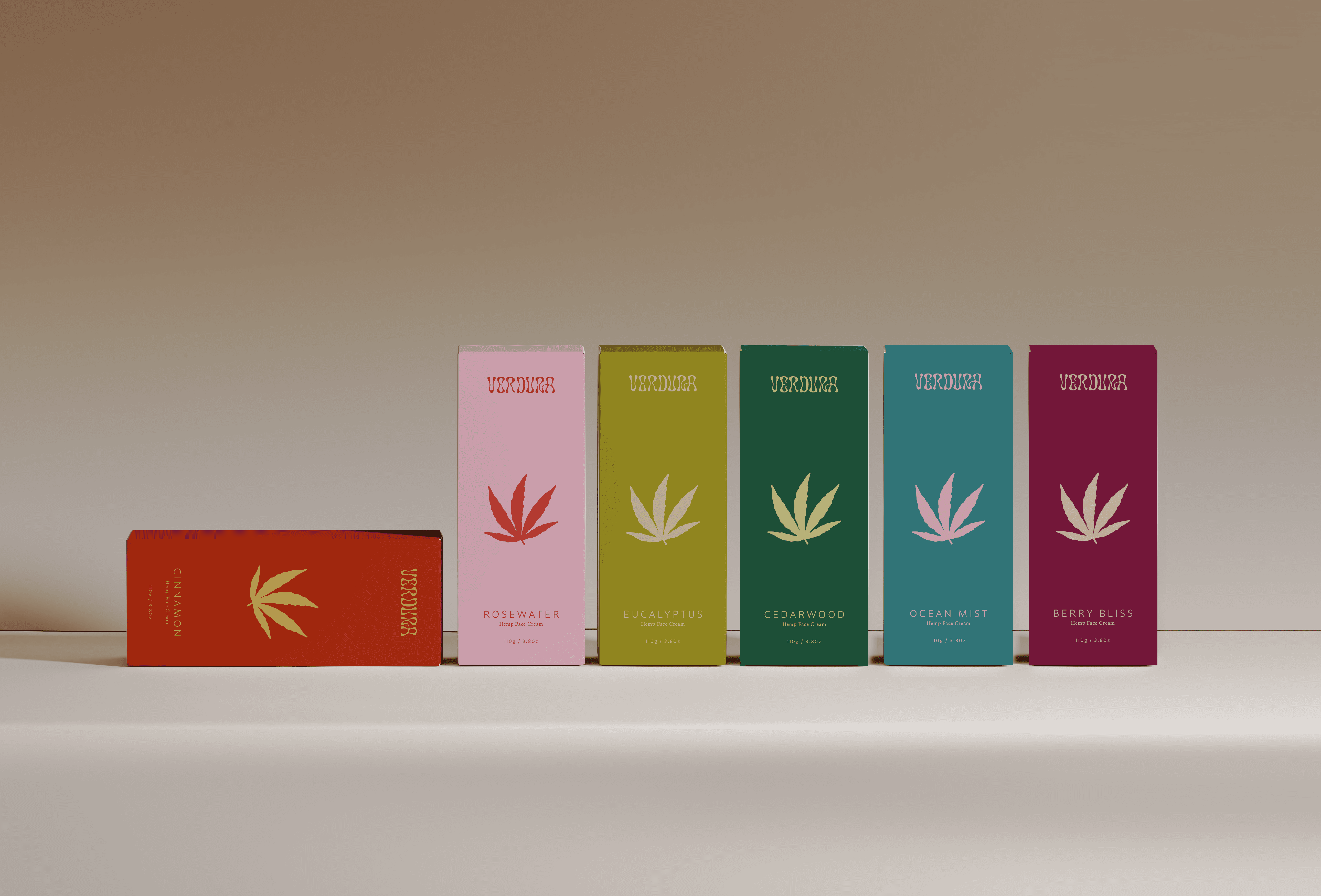 A woman in an orange sweater smiling while looking at a tablet, with a pen in hand.