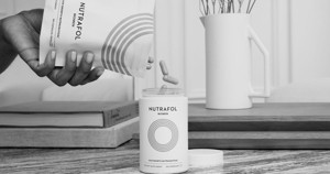 Abstract motion blur portrait with vibrant light streaks and dark background, creating a dynamic and surreal visual effect.