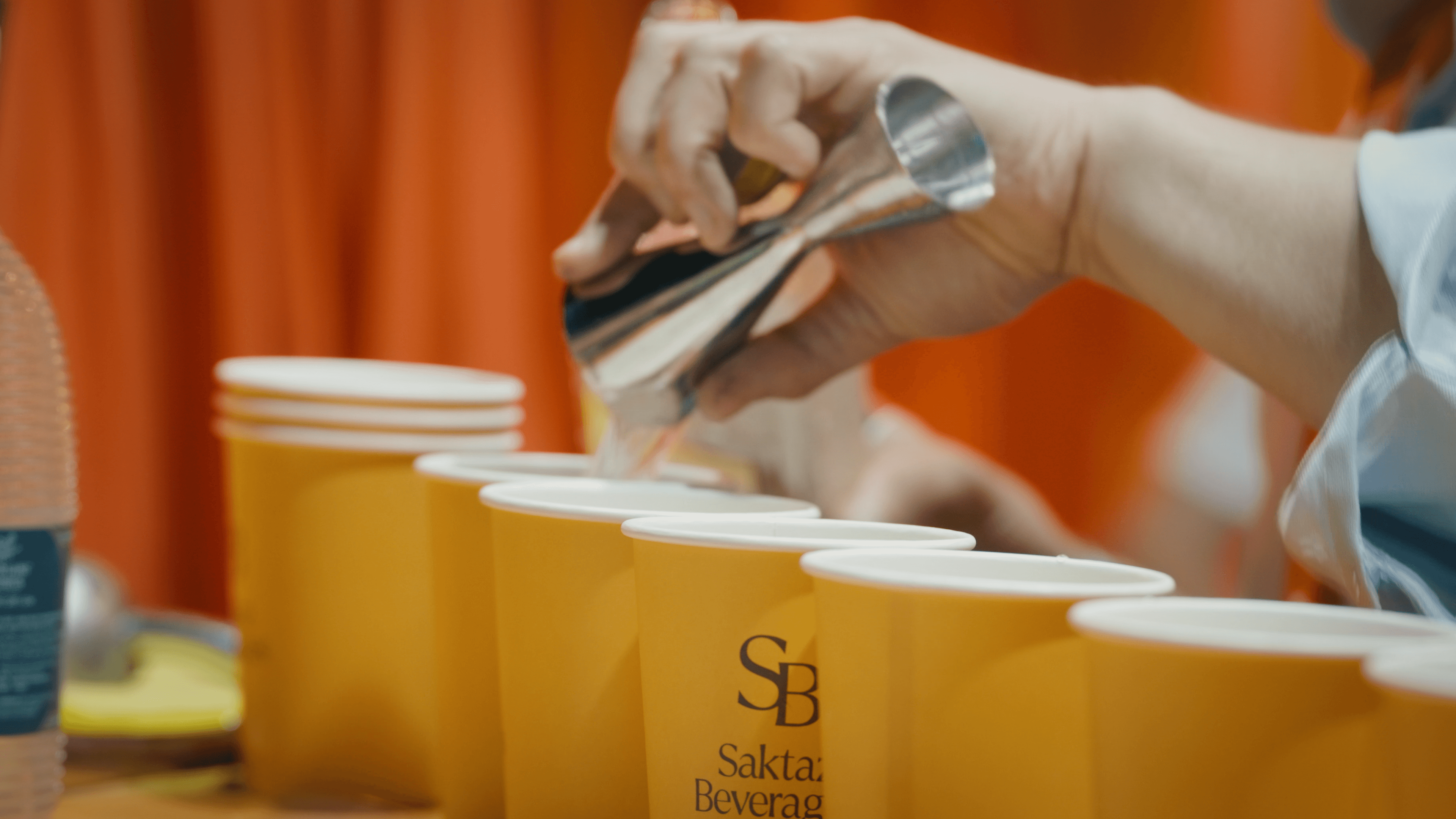 Tree branches reach towards a clear, blue sky.