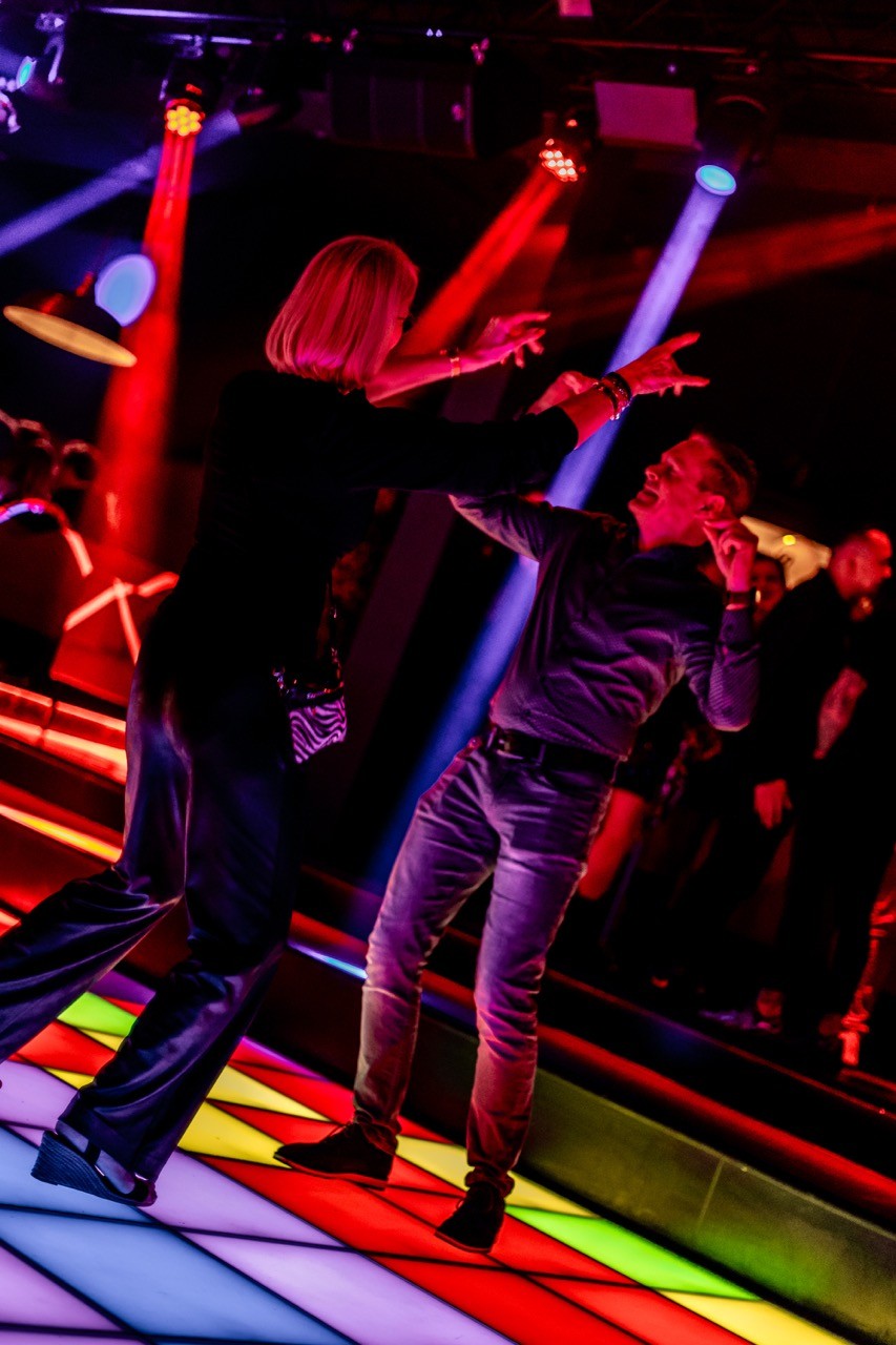 people dancing on dancefloor