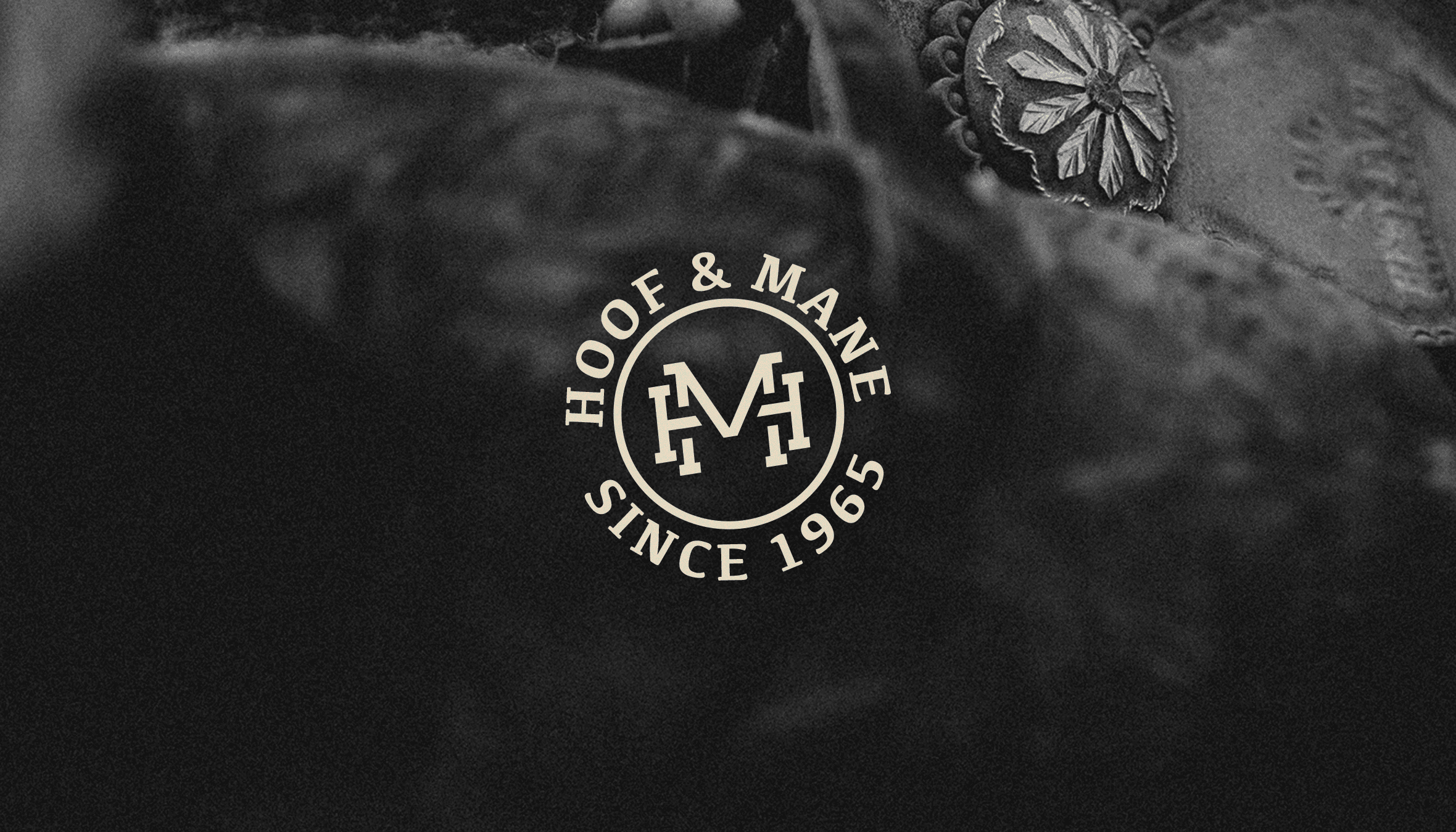 Black metallic foil pouch photographed from above, printed with a glossy white distressed smiley face logo (X eyes, tongue out) in the centre, faintly showing small white icon patterns beneath.