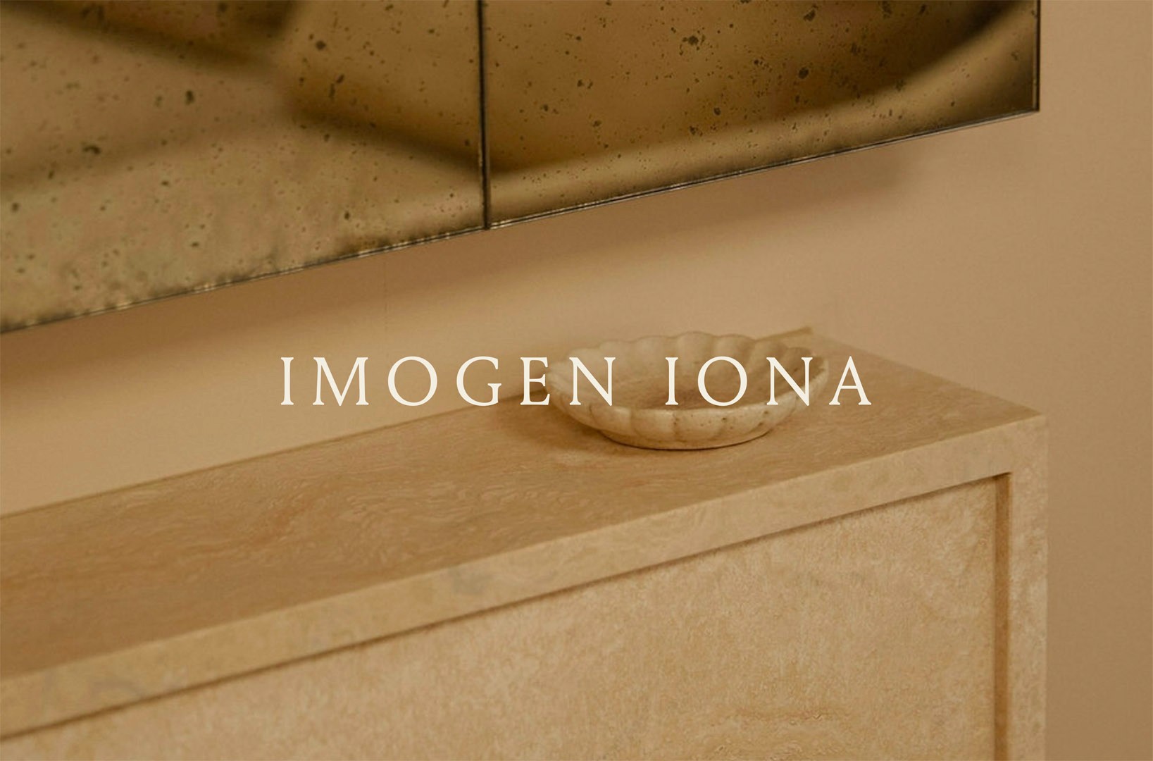 Dark brown background with the "Imogen Iona" 